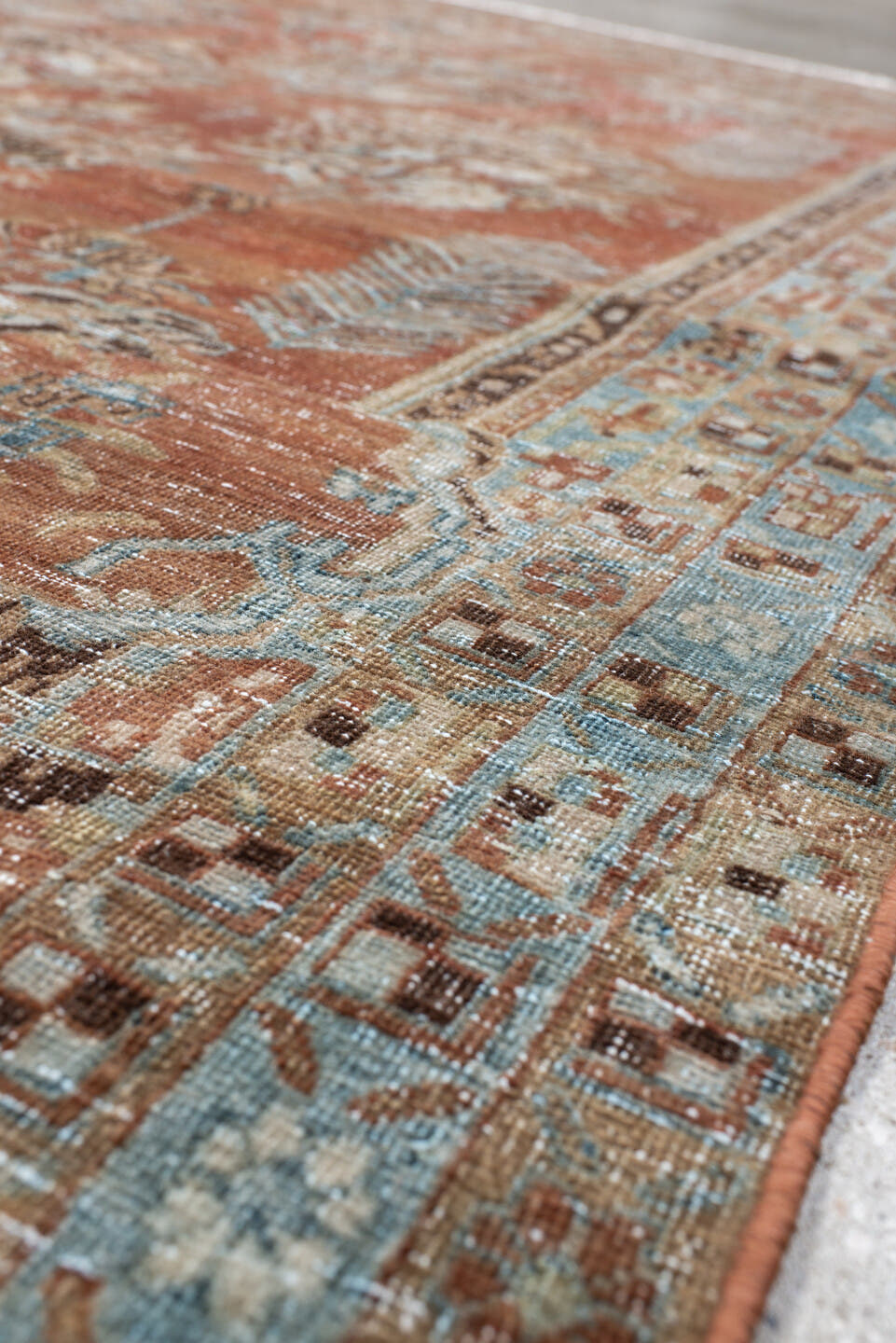 5' x 6' one-of-a-kind handmade vintage Afshar rug. Color palette: terra cotta, sky blue, ivory, taupe, brown, charcoal