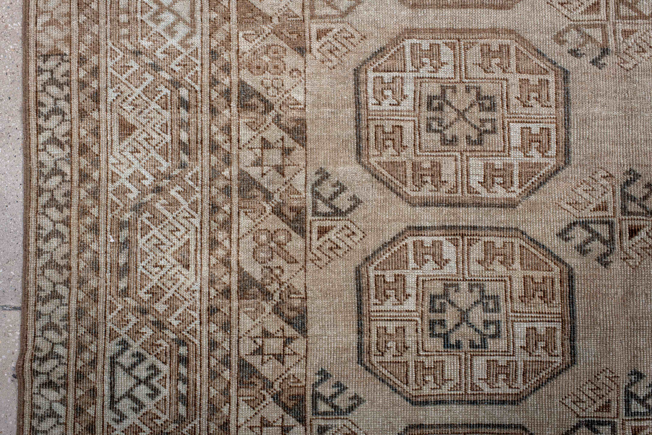 5' x 7' one-of-a-kind handmade antique Afghan rug. Color palette: ivory, taupe, camel, brown, charcoal, beige, gray, black