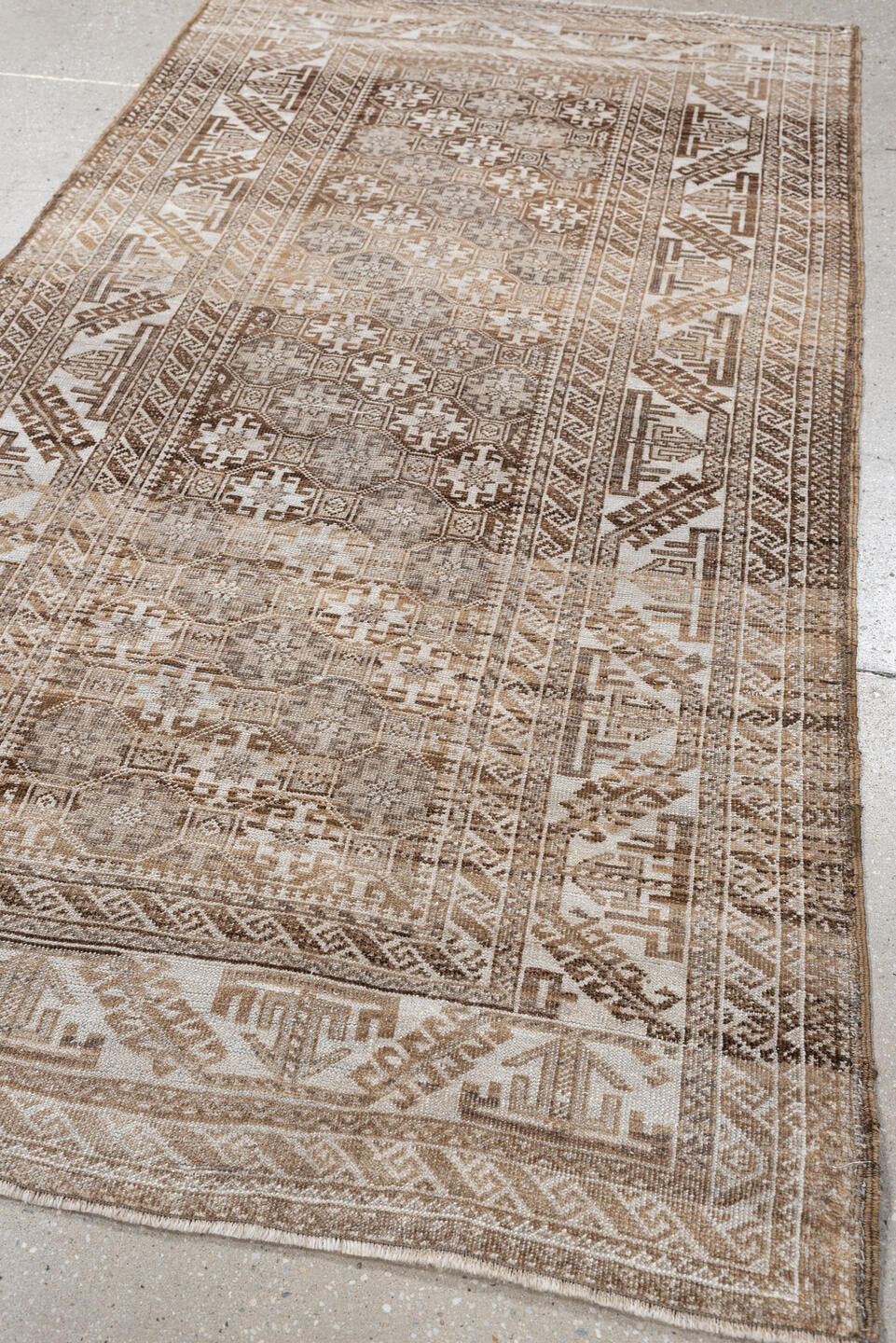 6' x 3' one-of-a-kind handmade antique Belouch rug. Color palette: camel, ivory, taupe, brown, sand, beige, gray