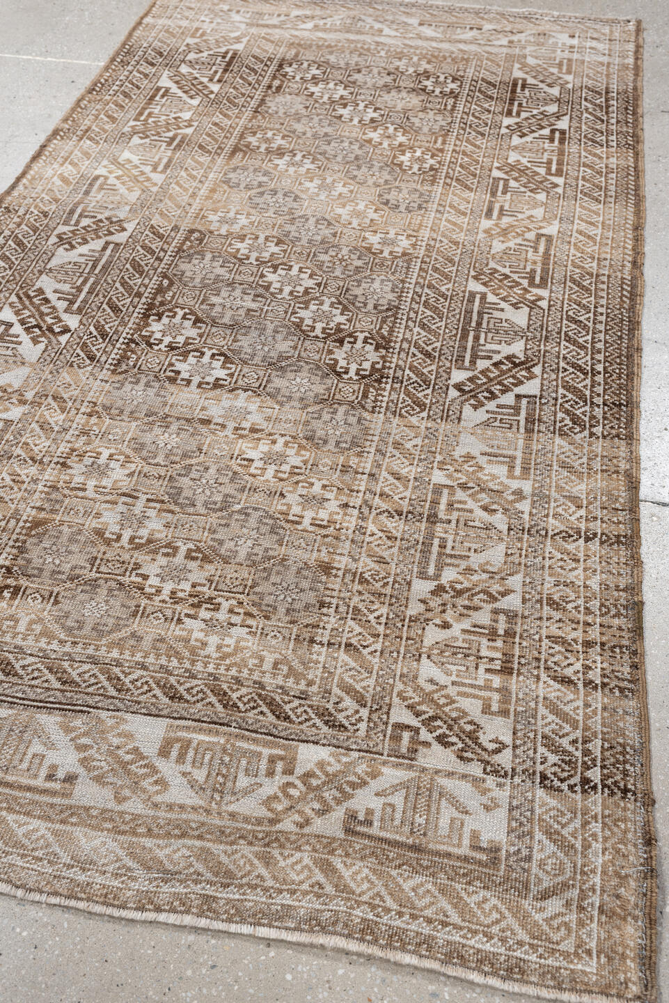 6' x 3' one-of-a-kind handmade antique Belouch rug. Color palette: camel, ivory, taupe, brown, sand, beige, gray