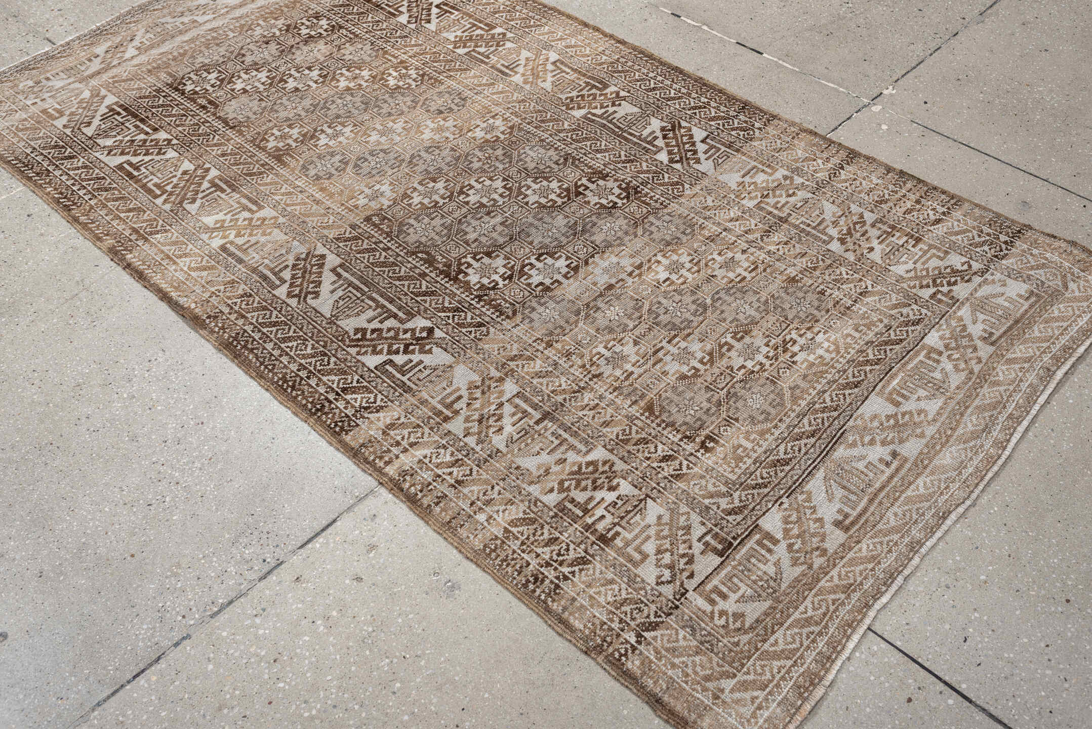 6' x 3' one-of-a-kind handmade antique Belouch rug. Color palette: camel, ivory, taupe, brown, sand, beige, gray