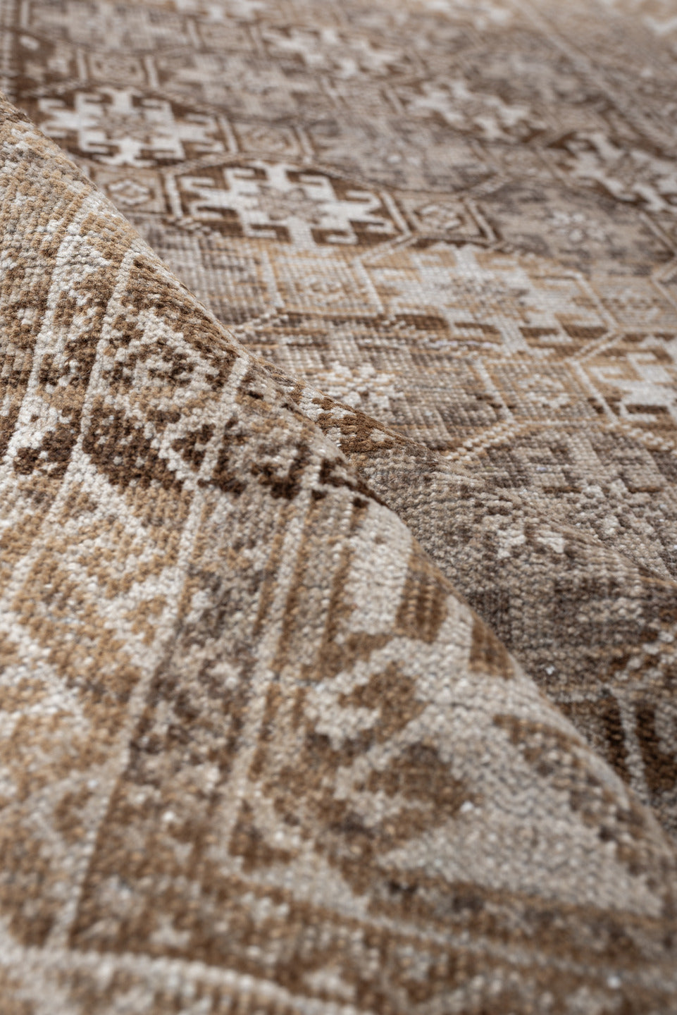 6' x 3' one-of-a-kind handmade antique Belouch rug. Color palette: camel, ivory, taupe, brown, sand, beige, gray