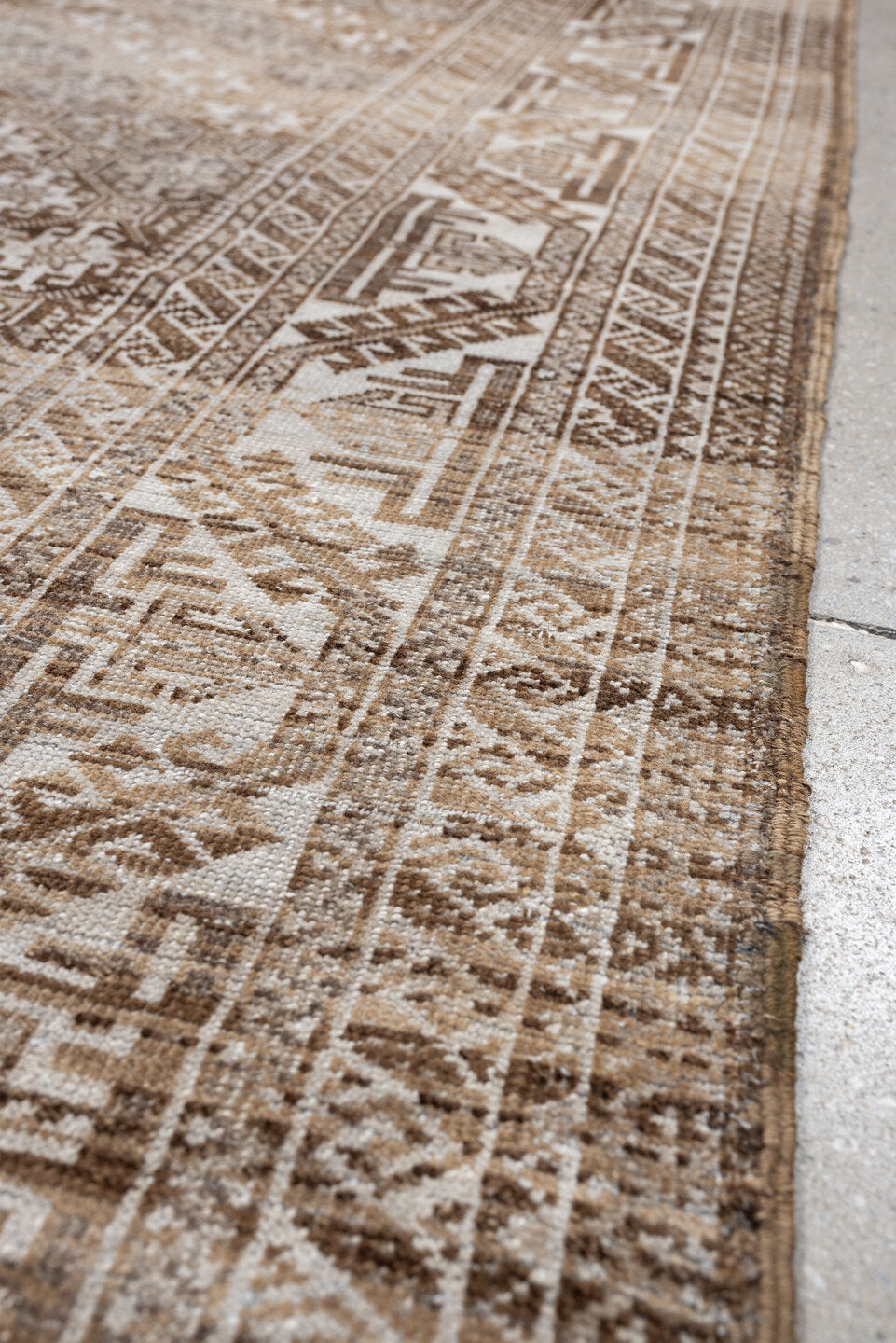 6' x 3' one-of-a-kind handmade antique Belouch rug. Color palette: camel, ivory, taupe, brown, sand, beige, gray