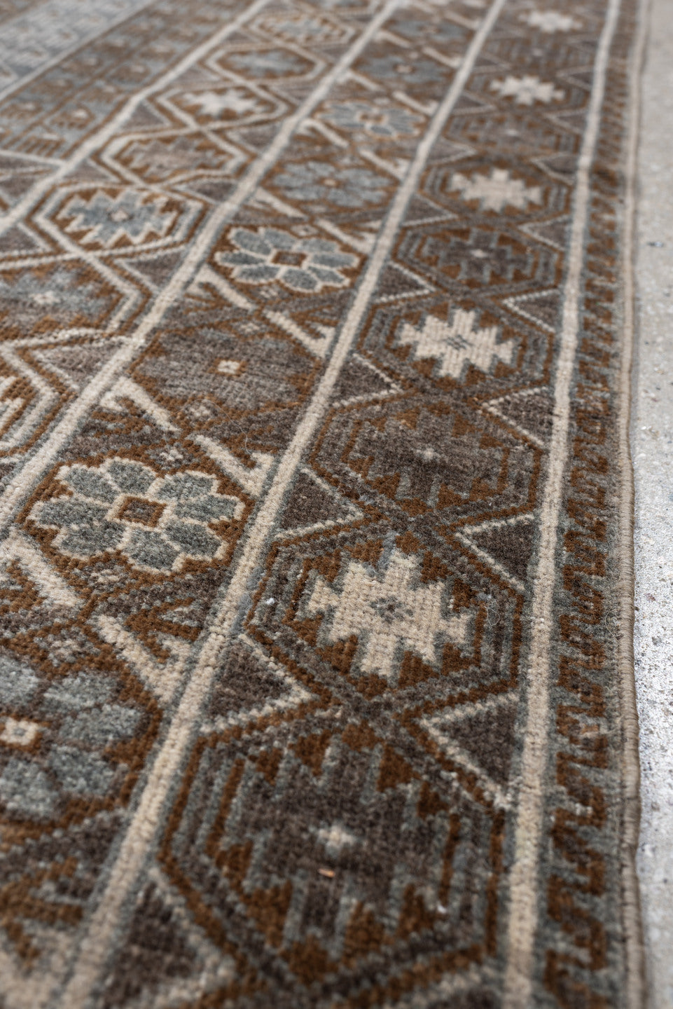 3' x 4' one-of-a-kind handmade antique Belouch small size rug. Color palette: camel, taupe, ivory, brown, gray, blue gray