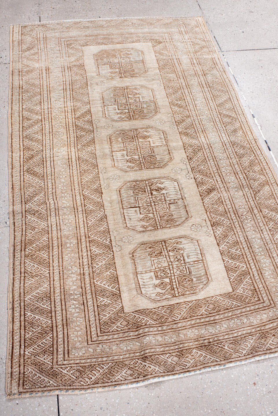 3' x 6' one-of-a-kind handmade antique Afghan small size rug. Color palette: camel, ivory, taupe, beige, sand, gray