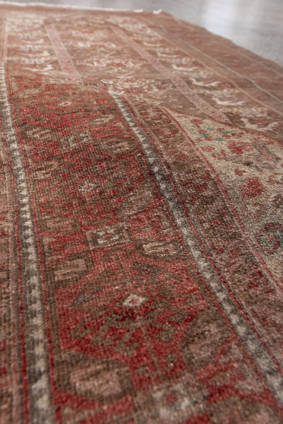 2' x 5' one-of-a-kind handmade antique Belouch small size rug. Color palette: rust, ivory, taupe, rose, sage, brown