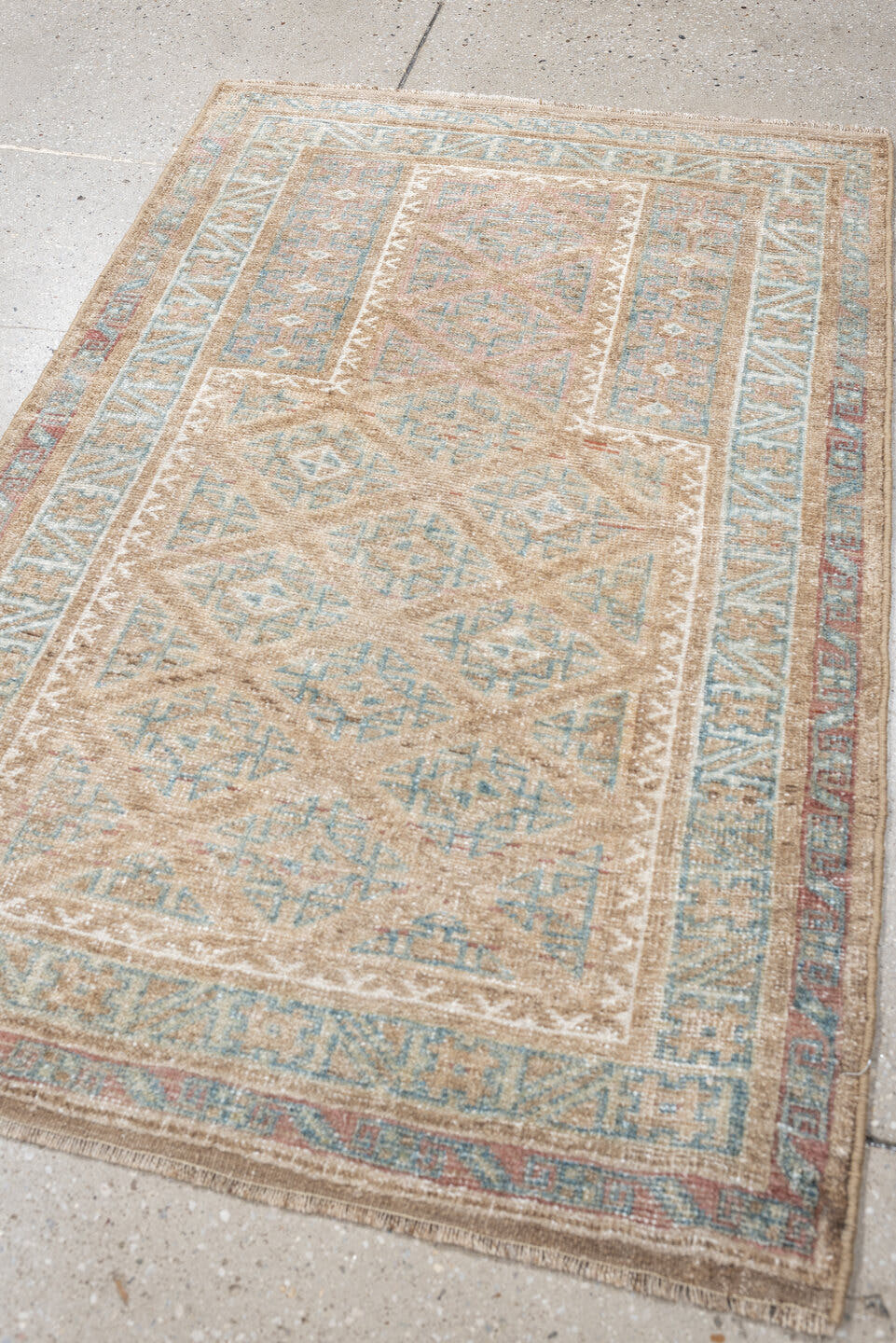 2' x 4' one-of-a-kind handmade antique Belouch small size rug. Color palette: camel, ivory, faded teal, taupe, muted rust