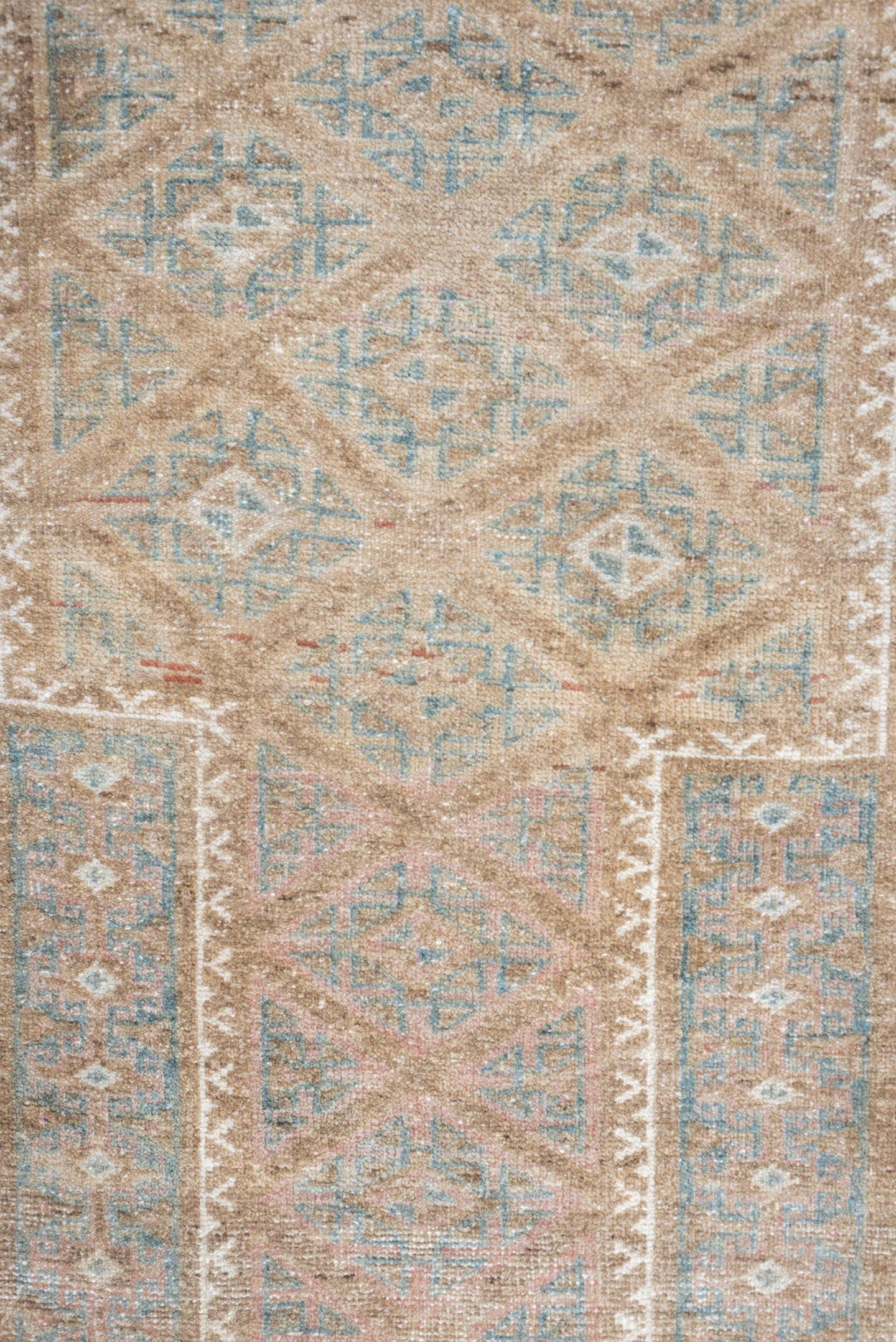 2' x 4' one-of-a-kind handmade antique Belouch small size rug. Color palette: camel, ivory, faded teal, taupe, muted rust