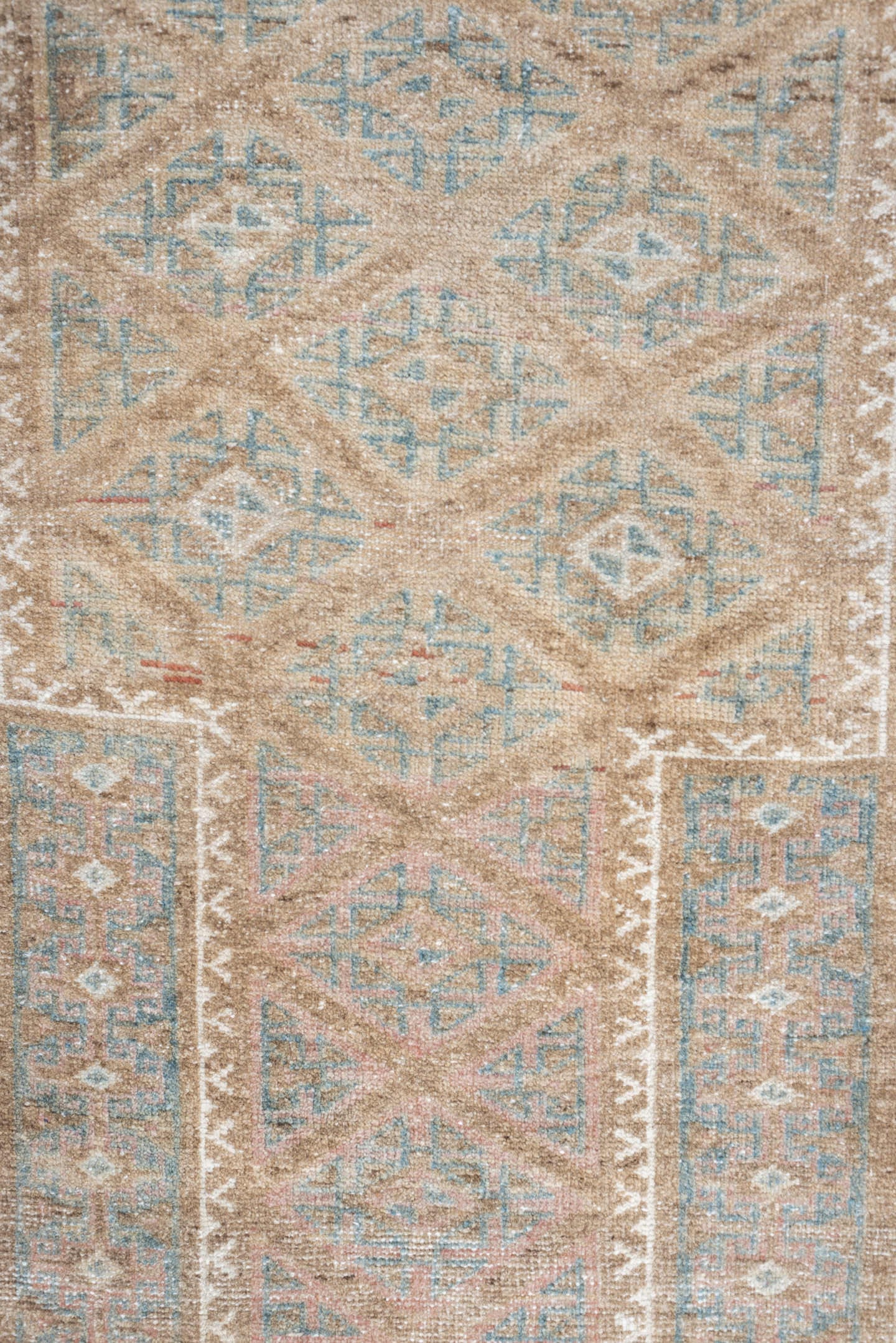 2' x 4' one-of-a-kind handmade antique Belouch small size rug. Color palette: camel, ivory, faded teal, taupe, muted rust