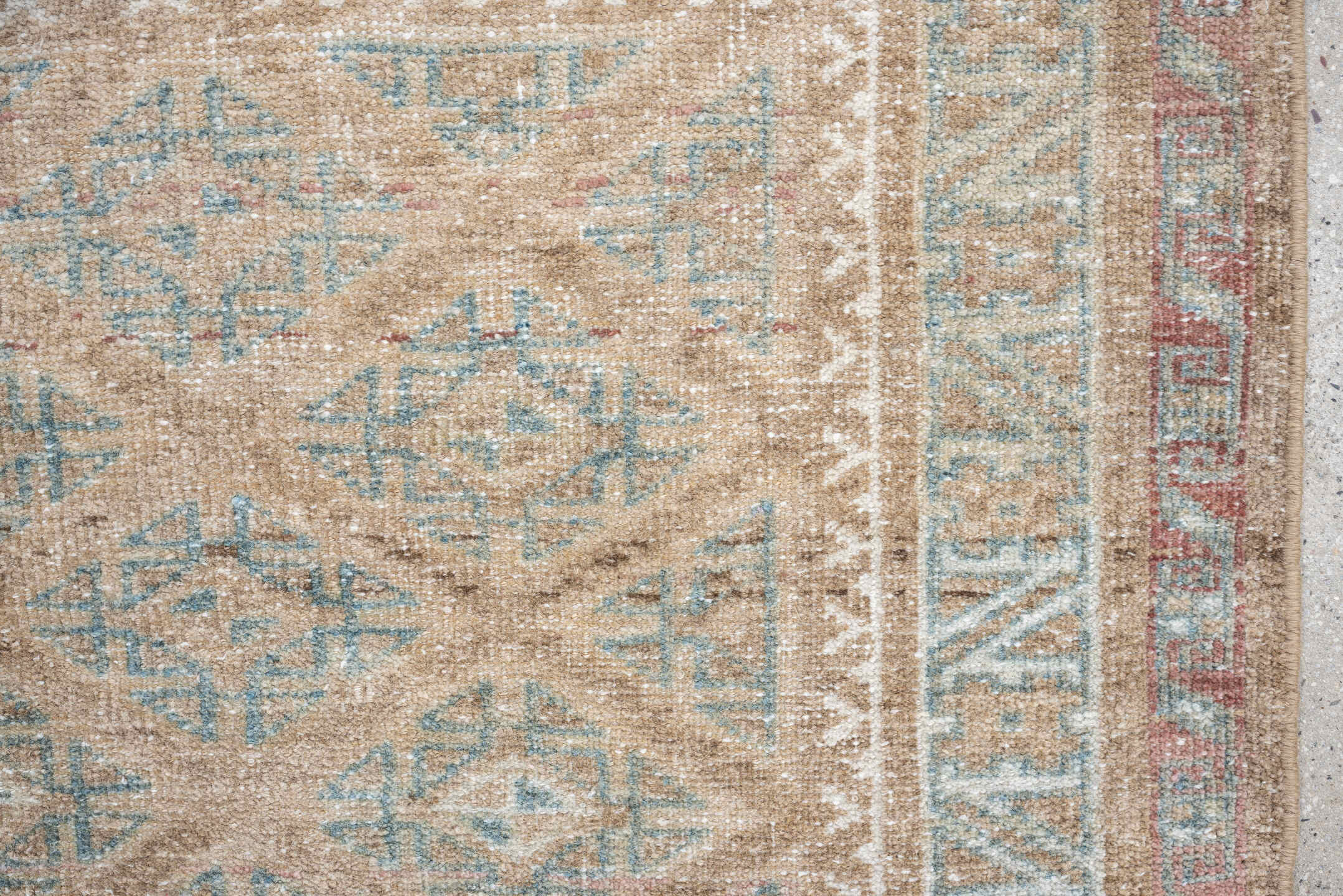 2' x 4' one-of-a-kind handmade antique Belouch small size rug. Color palette: camel, ivory, faded teal, taupe, muted rust