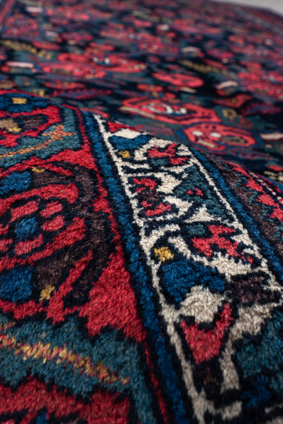 5' x 10' one-of-a-kind handmade antique Bidjar medium size rug. Color palette: navy, red, ivory, cobalt, rose, teal, gold