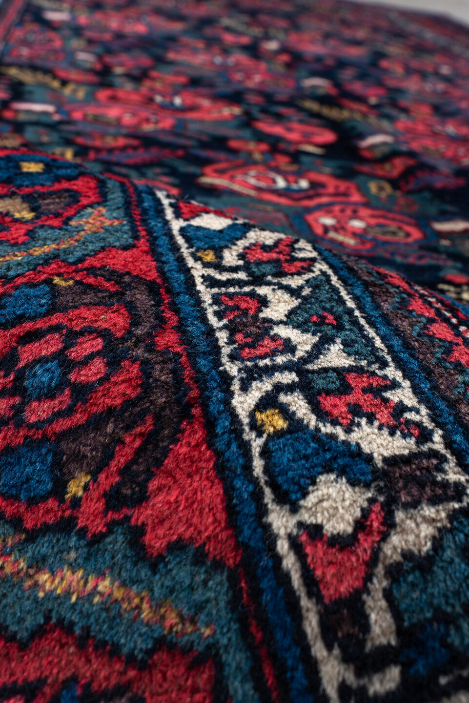 5' x 10' one-of-a-kind handmade antique Bidjar medium size rug. Color palette: navy, red, ivory, cobalt, rose, teal, gold