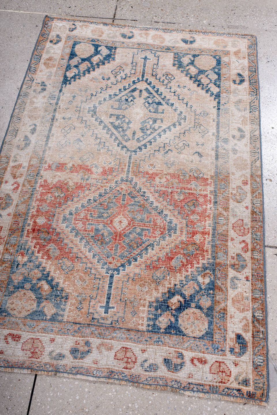 2' x 4' one-of-a-kind handmade antique Shiraz small size rug. Color palette: ivory, sky blue, coral, peach, faded red, beige