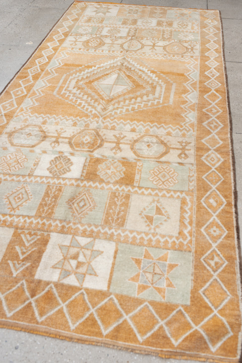 5' x 11' one-of-a-kind handmade antique Moroccan rug. Color palette: apricot, ivory, pale blue, sand, cream, terracotta
