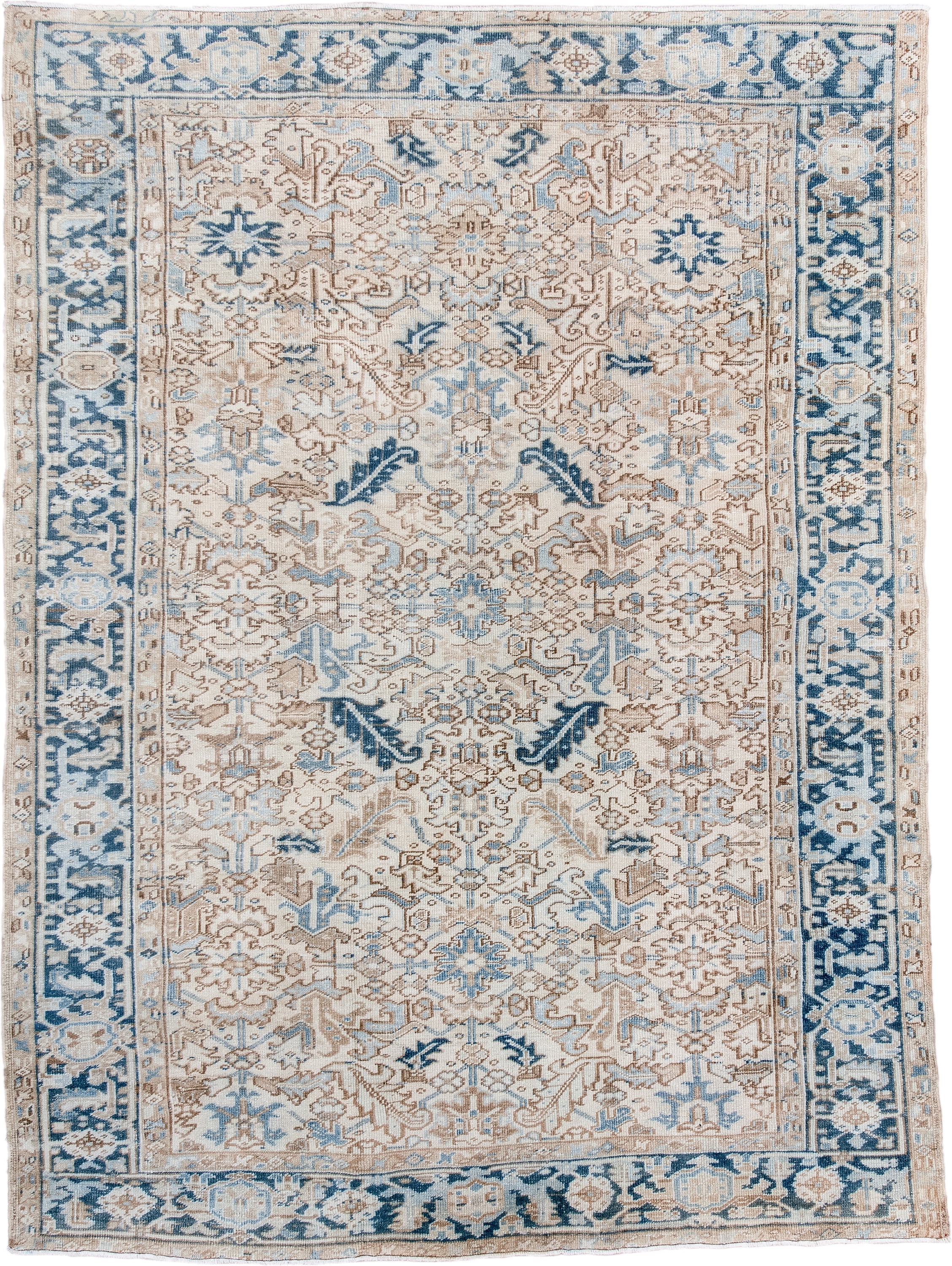 6' x 9' one-of-a-kind handmade antique Heriz rug. Color palette: ivory, sky blue, beige, navy, taupe, light blue, blue, gray