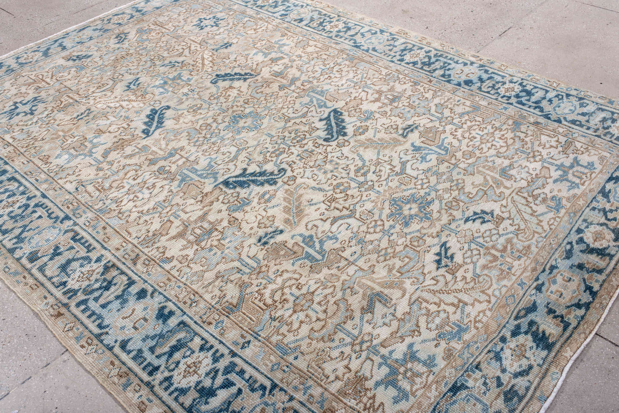 6' x 9' one-of-a-kind handmade antique Heriz rug. Color palette: ivory, sky blue, beige, navy, taupe, light blue, blue, gray
