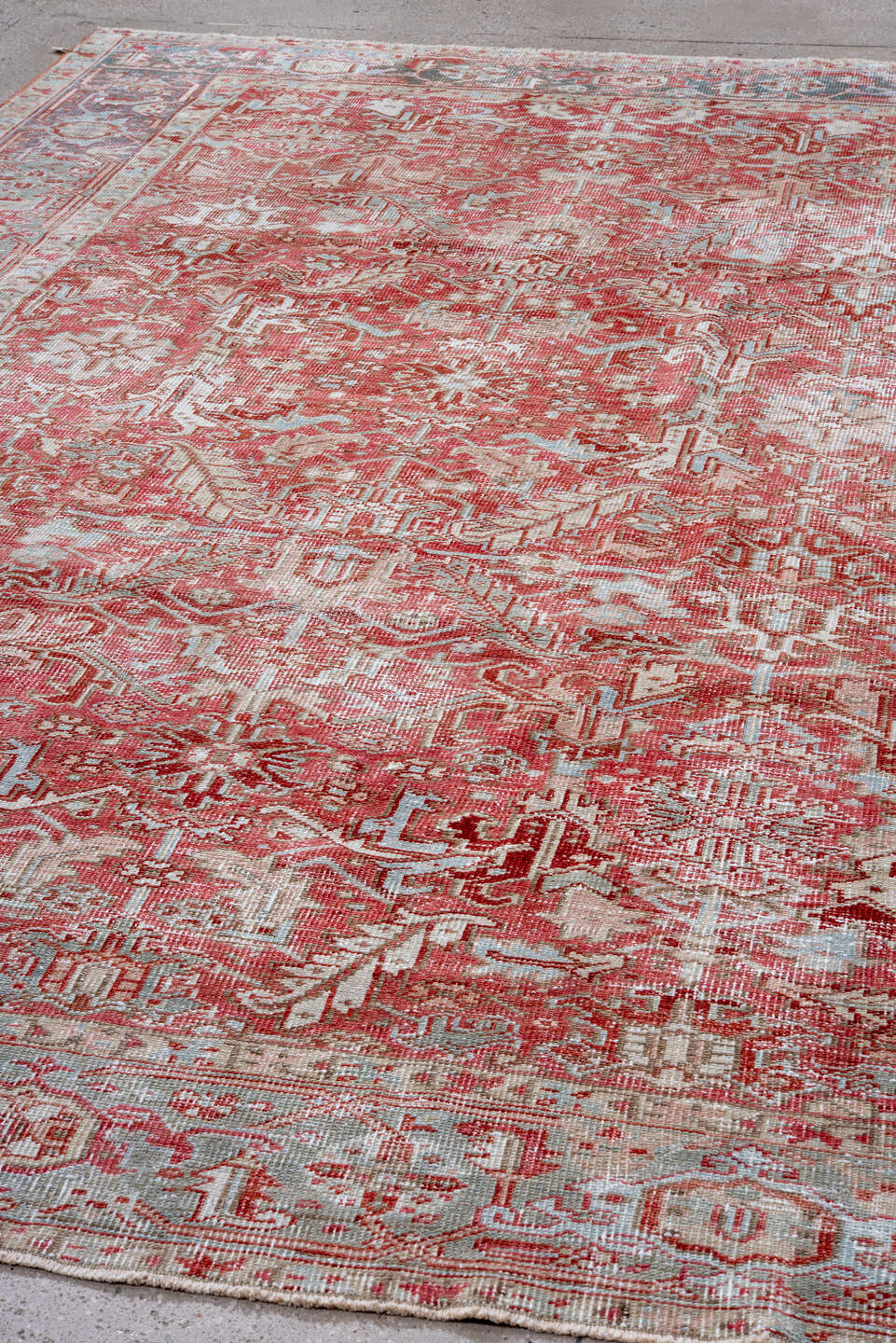 7' x 10' one-of-a-kind handmade vintage Heriz large size rug. Color palette: coral, pale blue, ivory, rust, rose, taupe