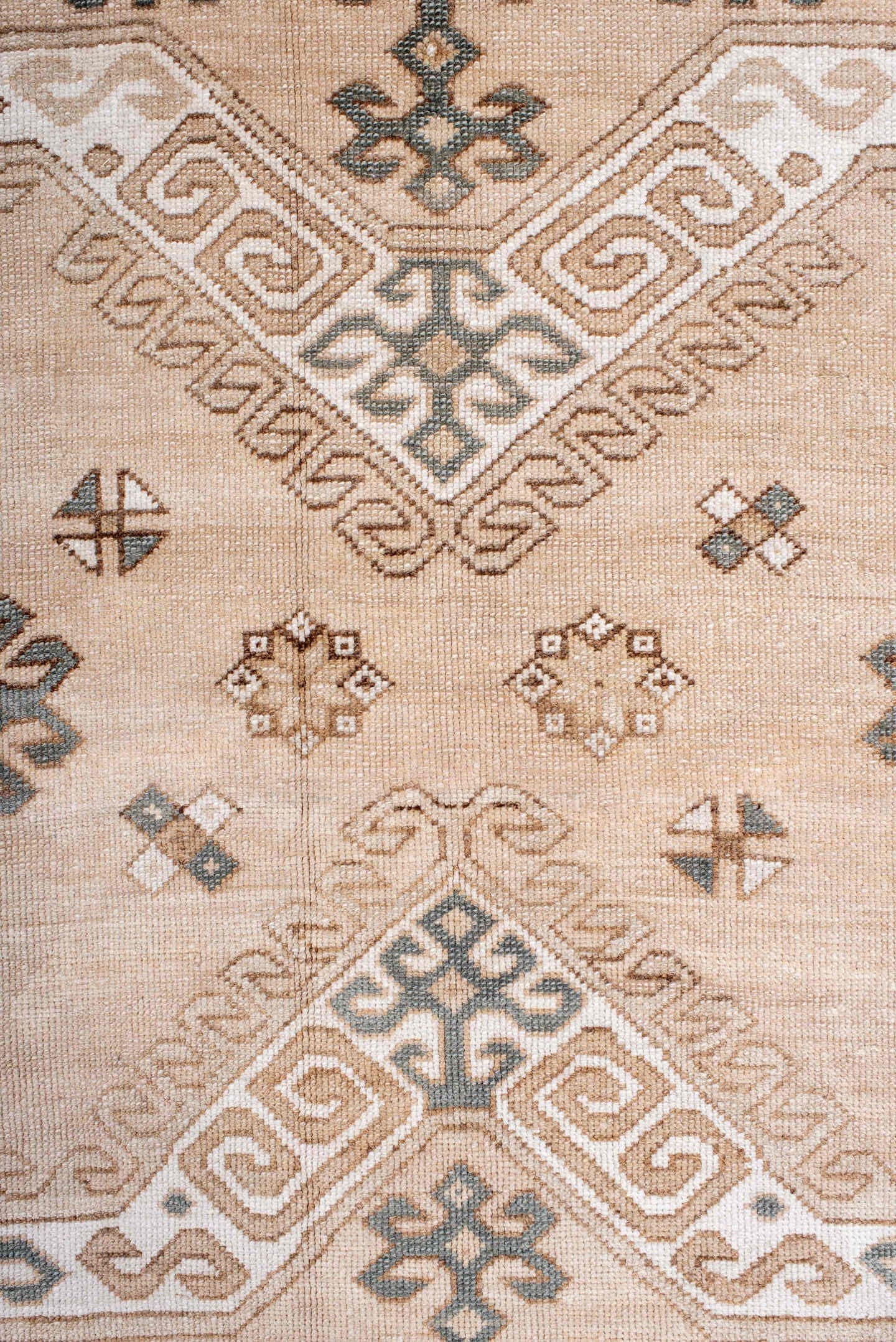7' x 9' one-of-a-kind handmade antique Trans Caucasian rug. Color palette: ivory, camel, taupe, slate, sand, pewter, beige