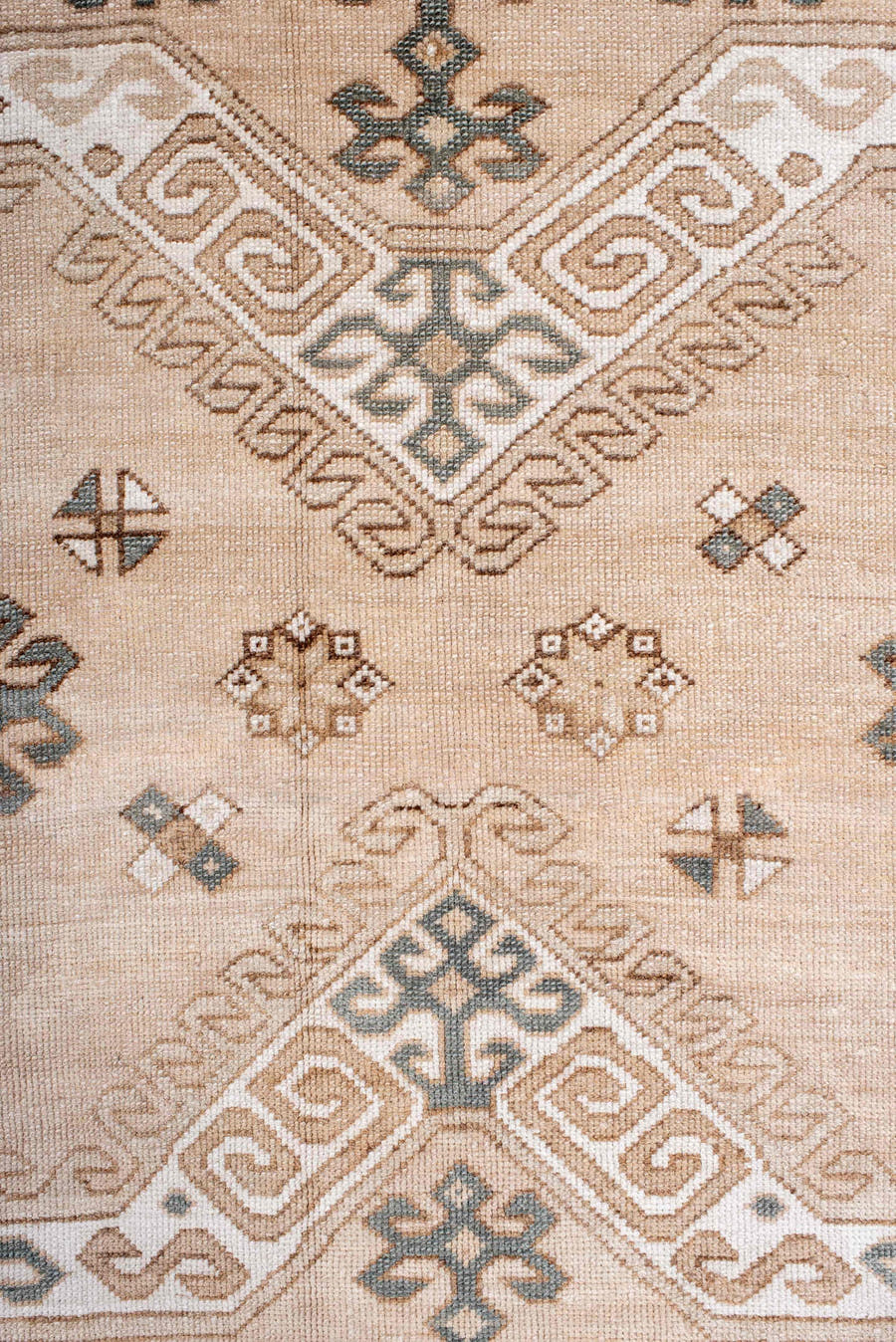 7' x 9' one-of-a-kind handmade antique Trans Caucasian rug. Color palette: ivory, camel, taupe, slate, sand, pewter, beige