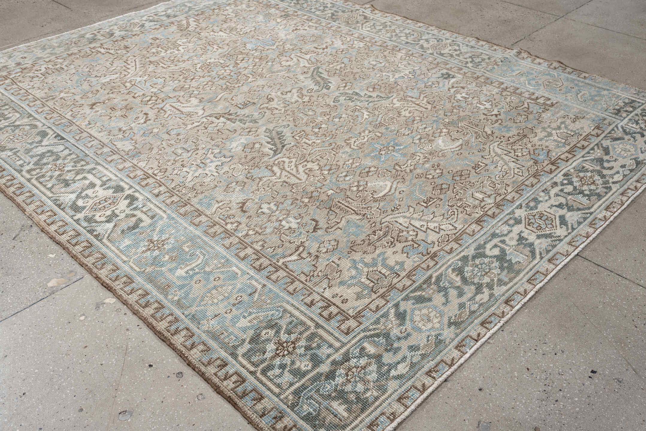 7' x 9' one-of-a-kind handmade vintage Heriz rug. Color palette: ivory, pale blue, taupe, slate, light gray, beige