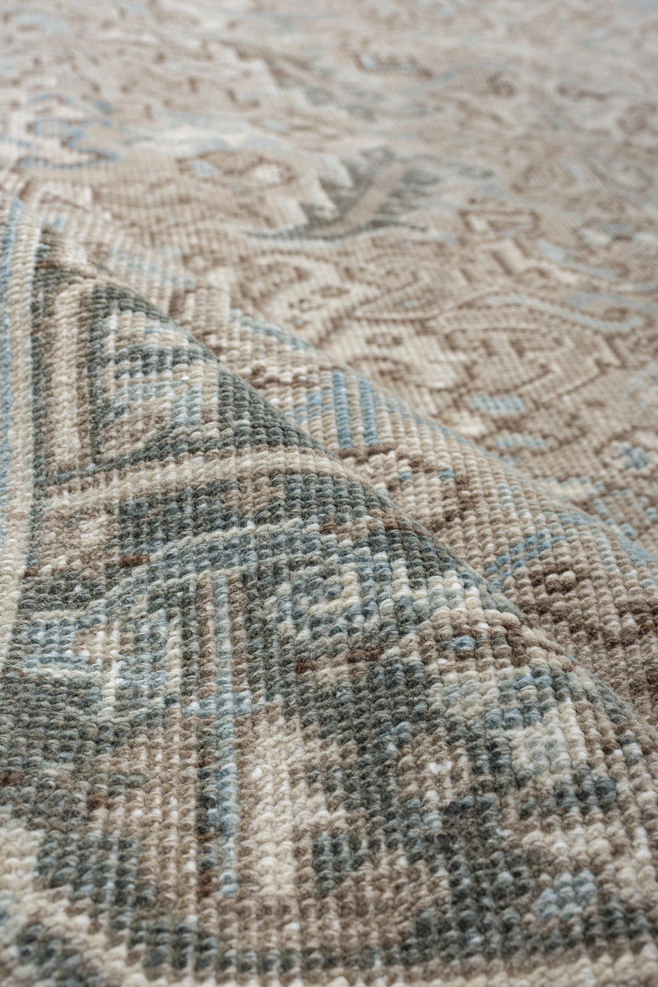 7' x 9' one-of-a-kind handmade vintage Heriz rug. Color palette: ivory, pale blue, taupe, slate, light gray, beige