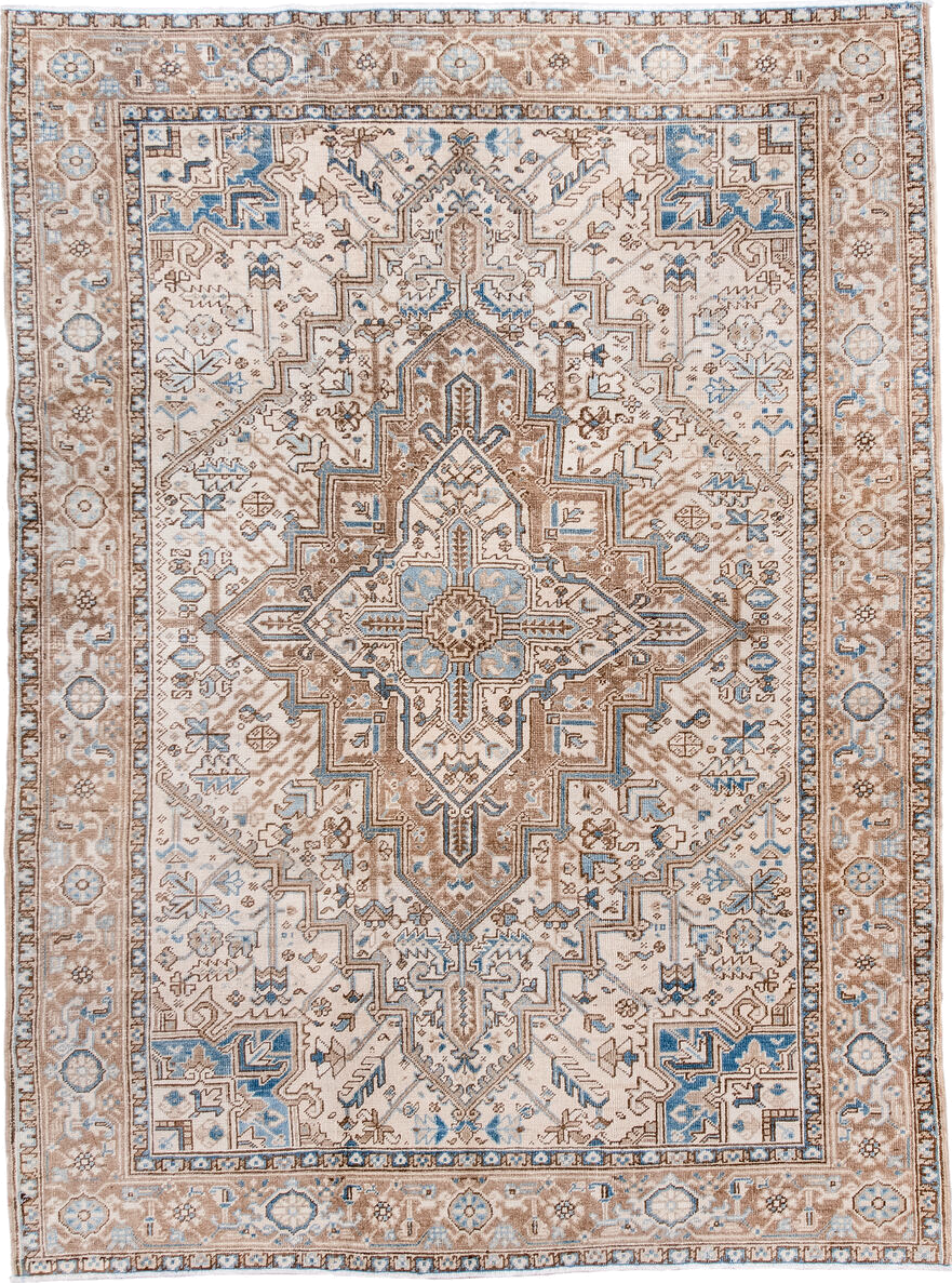 6' x 8' one-of-a-kind handmade antique Heriz medium size rug. Color palette: ivory, taupe, sky blue, camel, brown, beige