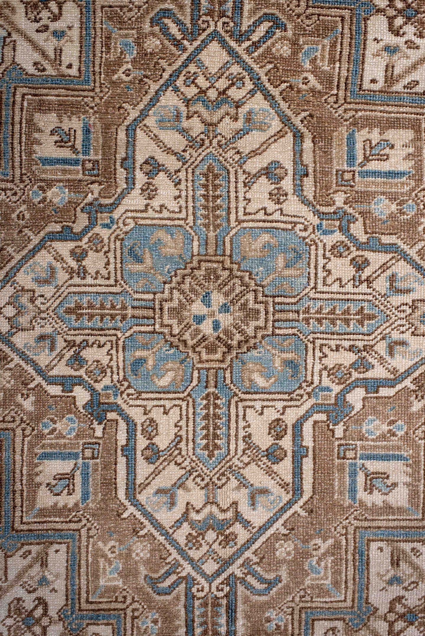 6' x 8' one-of-a-kind handmade antique Heriz medium size rug. Color palette: ivory, taupe, sky blue, camel, brown, beige