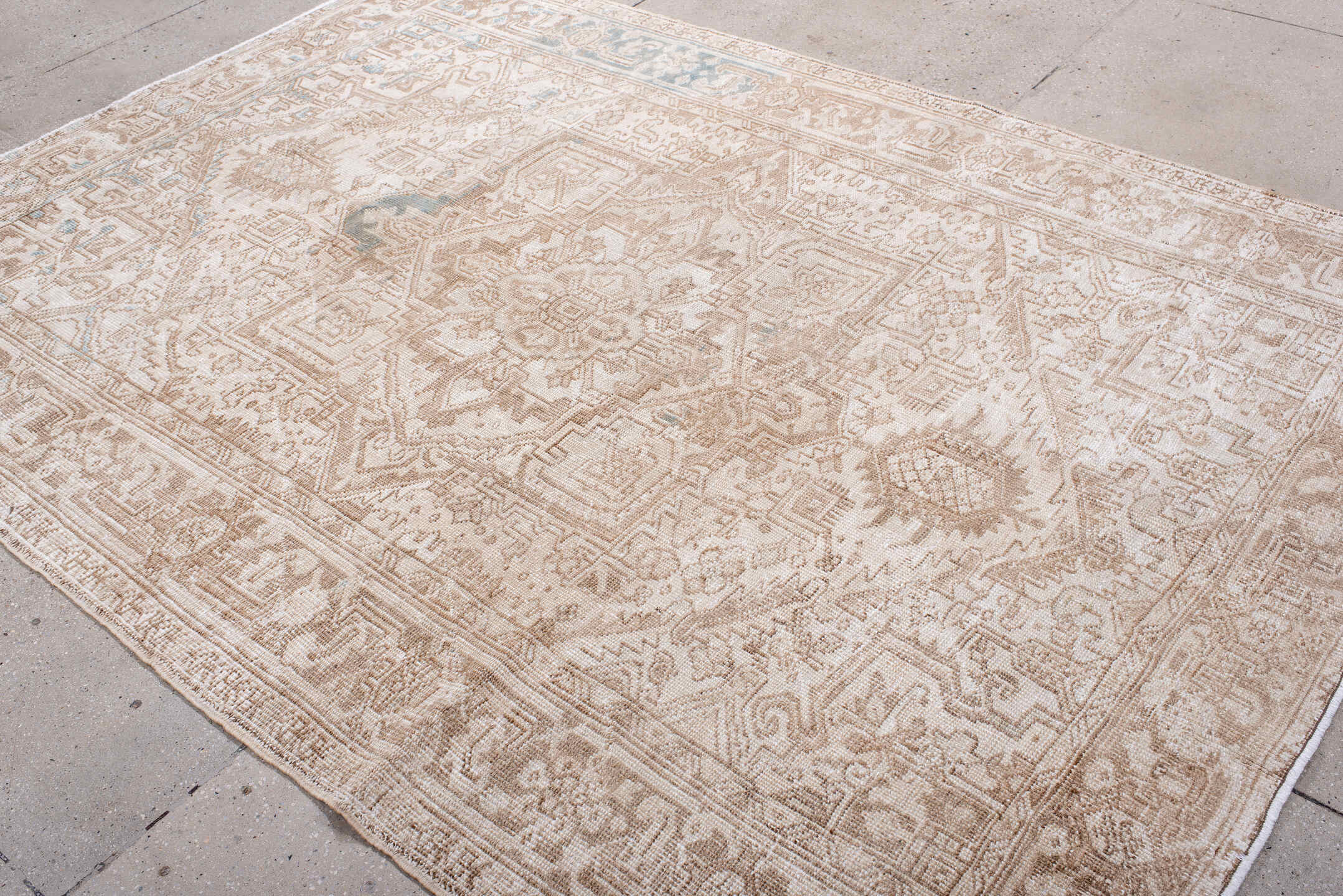 6' x 8' one-of-a-kind handmade antique Heriz medium size rug. Color palette: ivory, camel, taupe, beige, pale blue, sand