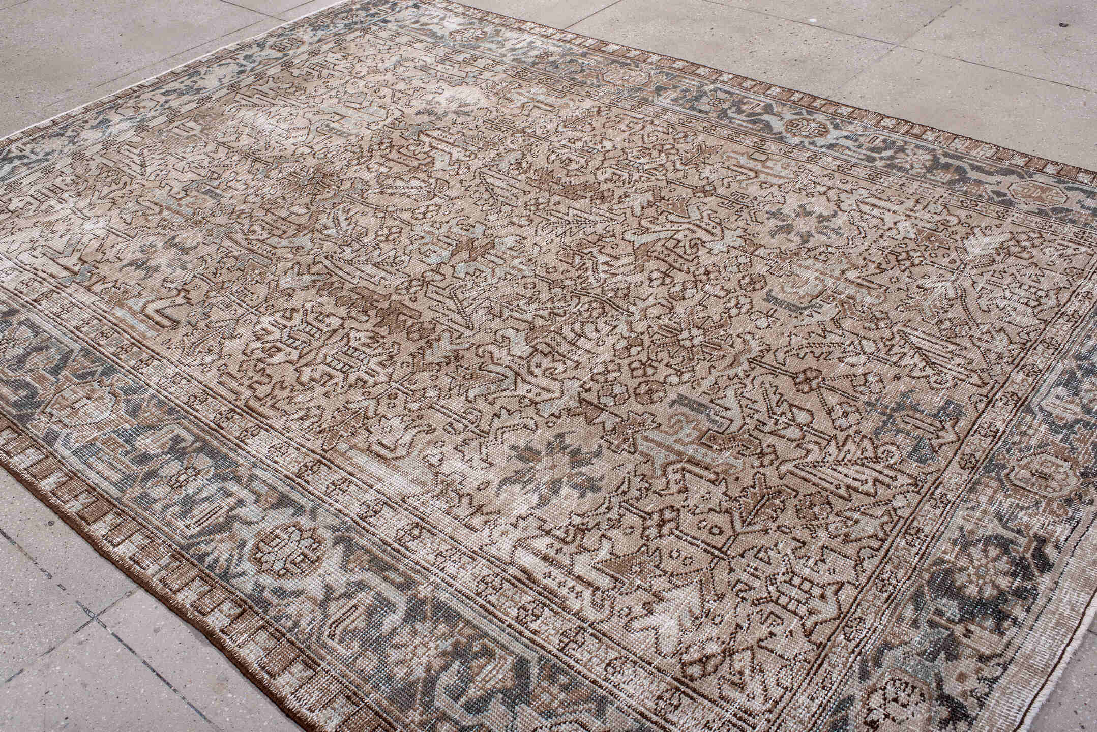 7' x 10' one-of-a-kind handmade antique Heriz large size rug. Color palette: ivory, taupe, charcoal, brown, beige, slate