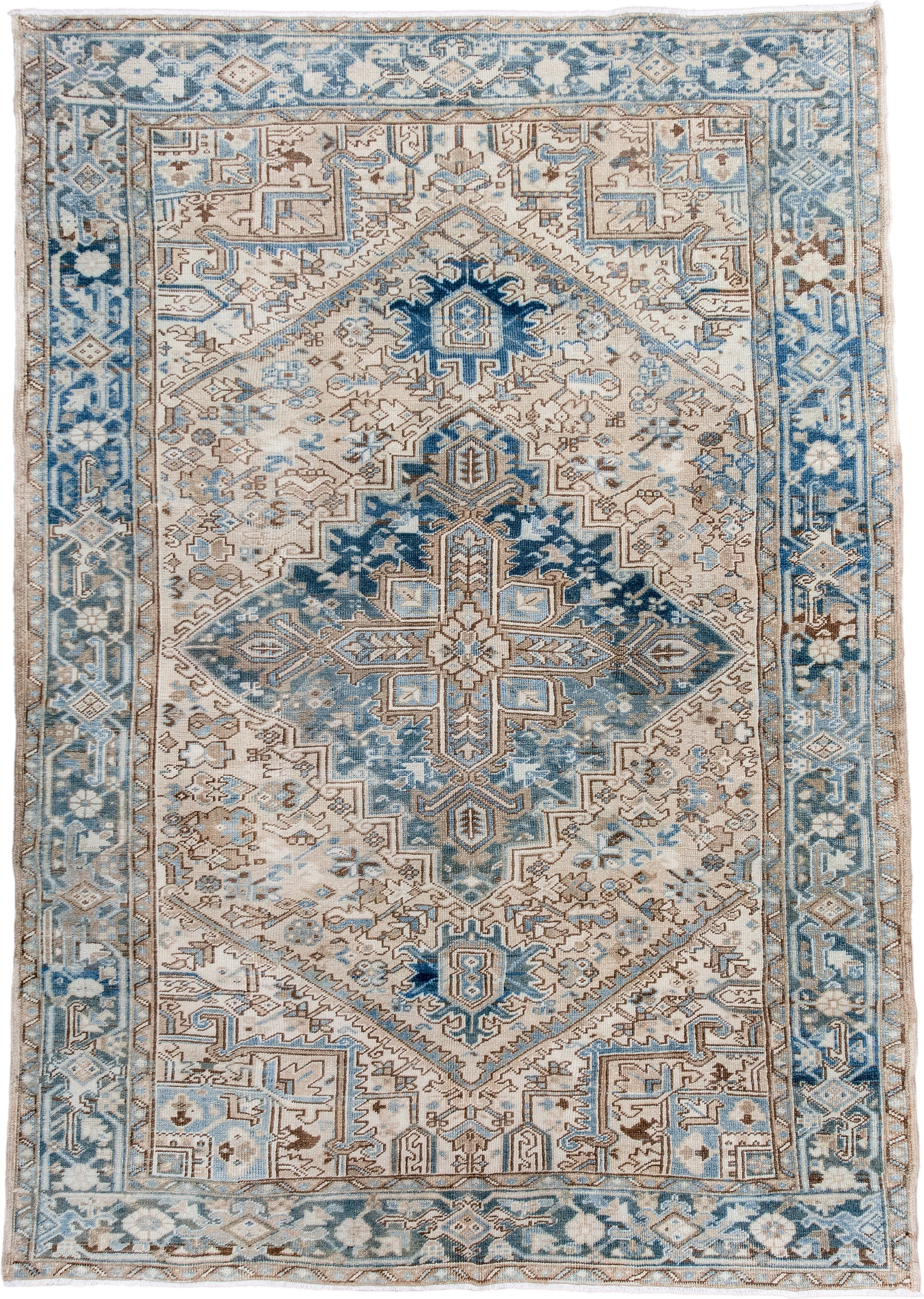 6' x 9' one-of-a-kind handmade antique Heriz medium size rug. Color palette: ivory, sky blue, denim blue, taupe, beige