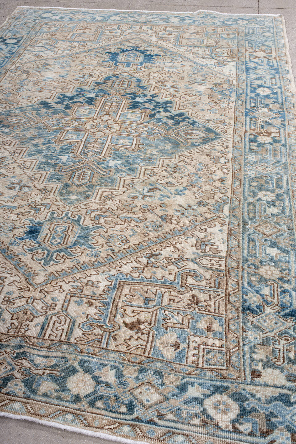 6' x 9' one-of-a-kind handmade antique Heriz medium size rug. Color palette: ivory, sky blue, denim blue, taupe, beige