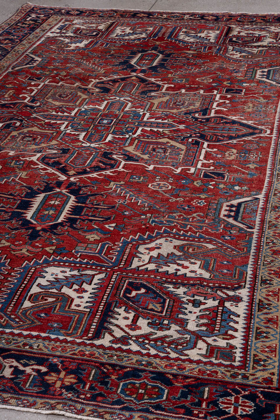 7' x 11' one-of-a-kind handmade vintage Heriz large size rug. Color palette: rust, navy, ivory, sky blue, camel, crimson