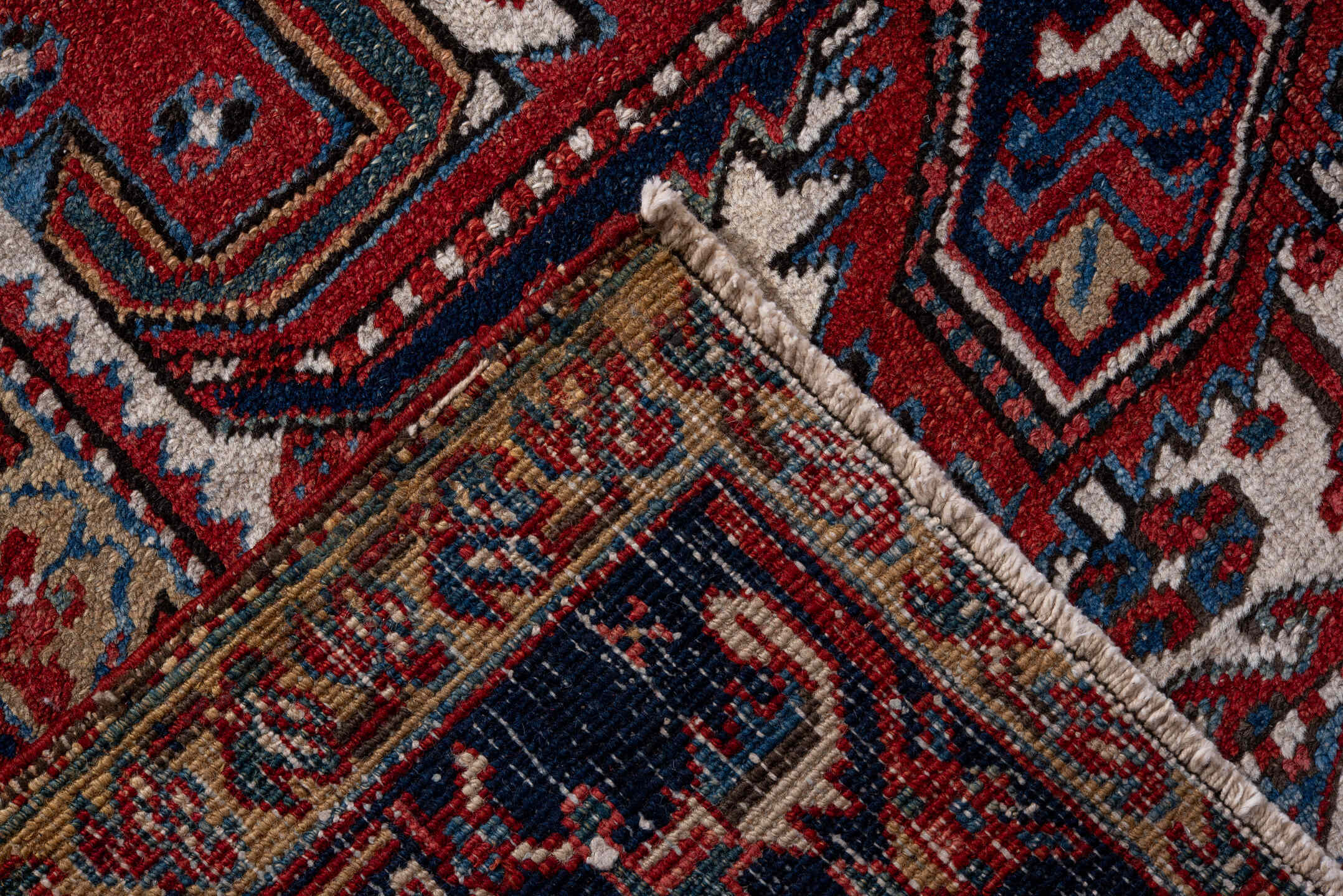 7' x 11' one-of-a-kind handmade vintage Heriz large size rug. Color palette: rust, navy, ivory, sky blue, camel, crimson