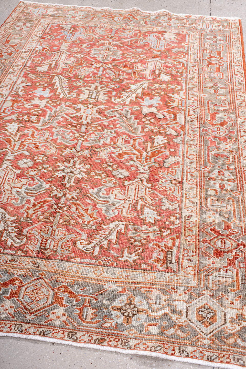 5' x 7' one-of-a-kind handmade vintage Heriz rug. Color palette: coral, ivory, taupe, terra cotta, camel, sage, terracotta