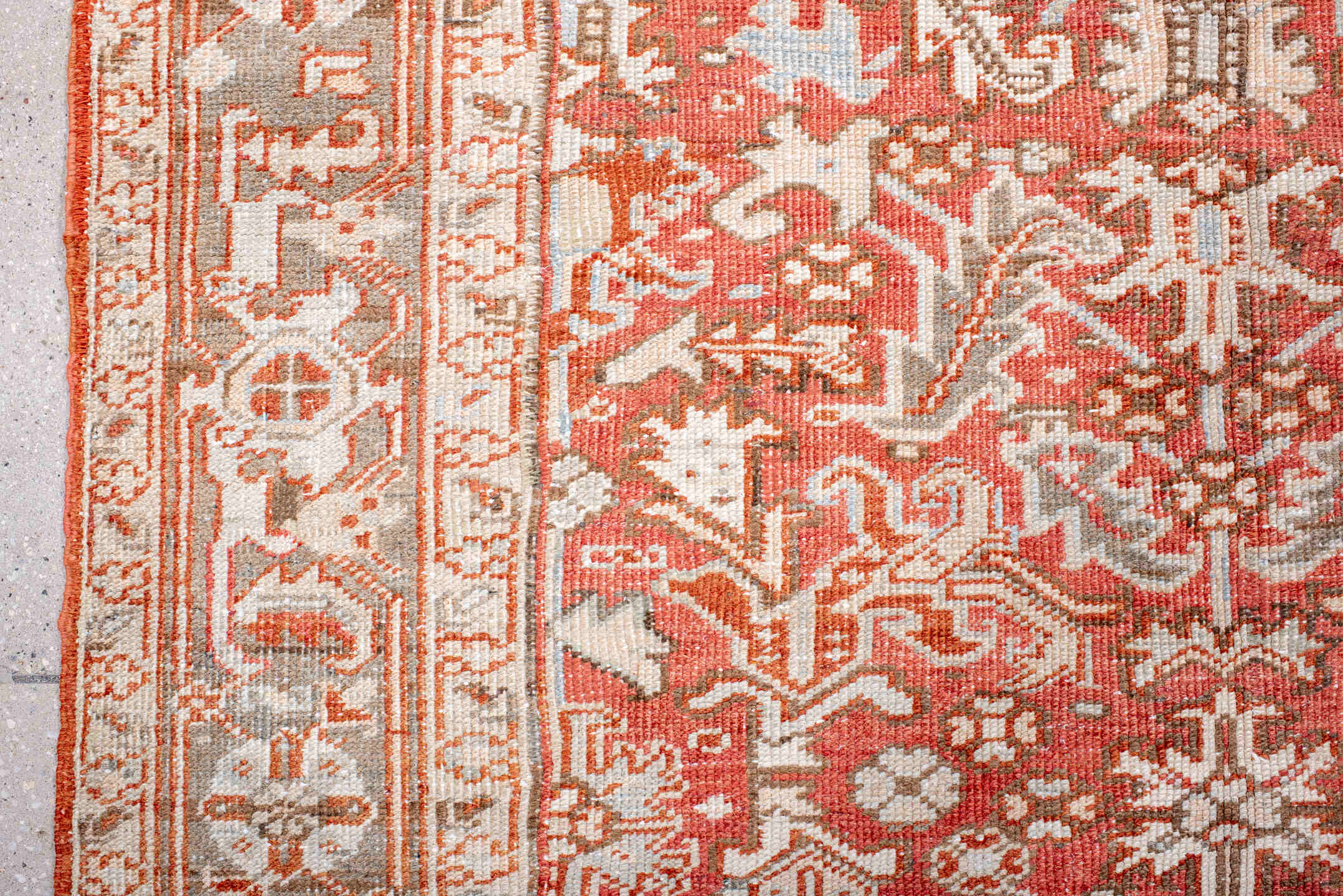 5' x 7' one-of-a-kind handmade vintage Heriz rug. Color palette: coral, ivory, taupe, terra cotta, camel, sage, terracotta