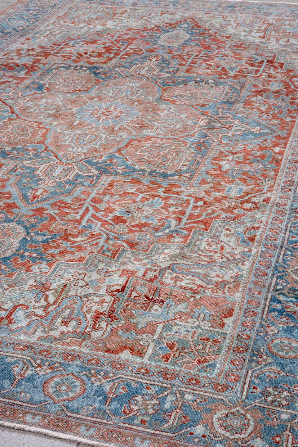 7' x 11' one-of-a-kind handmade vintage Heriz large size rug. Color palette: terra cotta, powder blue, ivory, rust, sky blue
