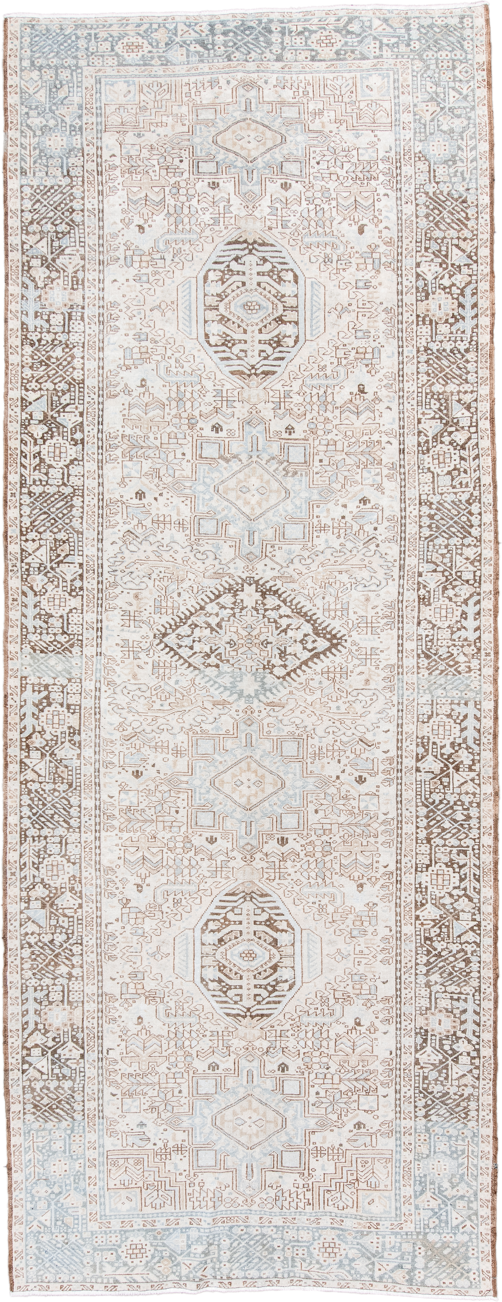 5' x 12' one-of-a-kind handmade antique Karaje runner rug. Color palette: ivory, pale blue, taupe, camel, light brown