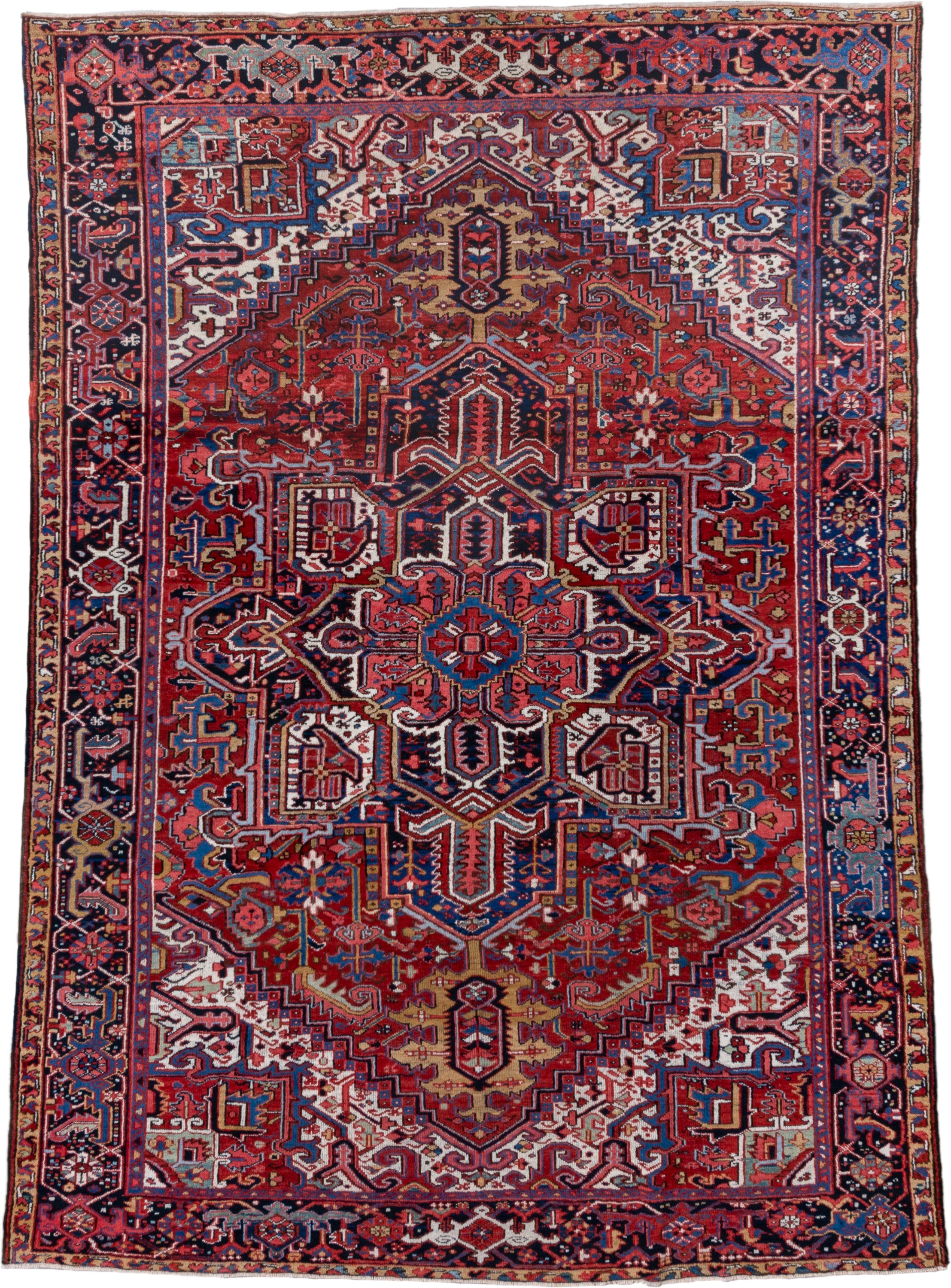 7' x 10' one-of-a-kind handmade vintage Heriz large size rug. Color palette: rust, navy, ivory, crimson, cobalt, camel, rose