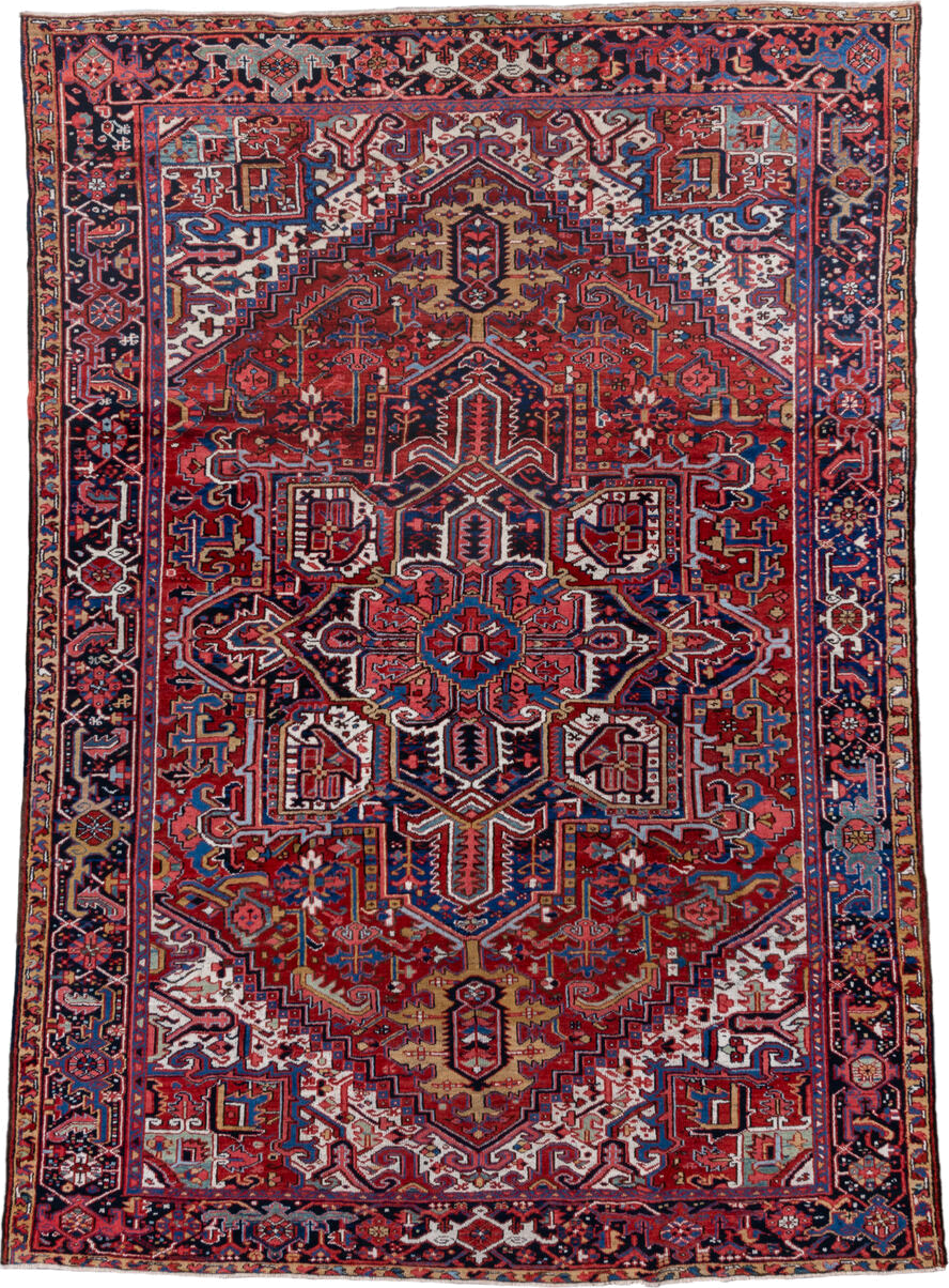 7' x 10' one-of-a-kind handmade vintage Heriz large size rug. Color palette: rust, navy, ivory, crimson, cobalt, camel, rose