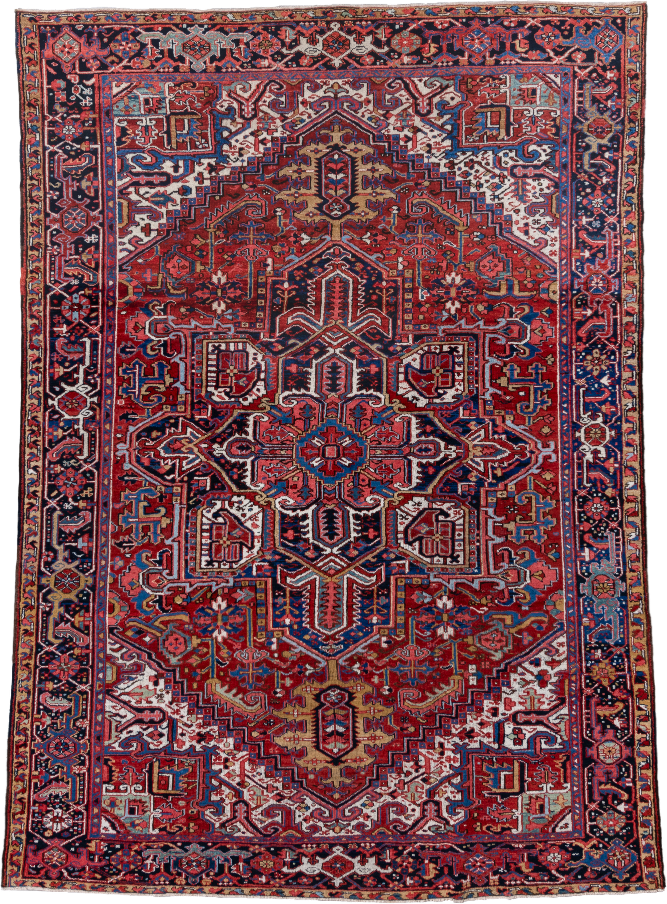 7' x 10' one-of-a-kind handmade vintage Heriz large size rug. Color palette: rust, navy, ivory, crimson, cobalt, camel, rose