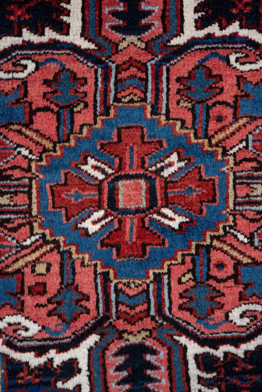 7' x 10' one-of-a-kind handmade vintage Heriz large size rug. Color palette: rust, navy, ivory, crimson, cobalt, camel, rose