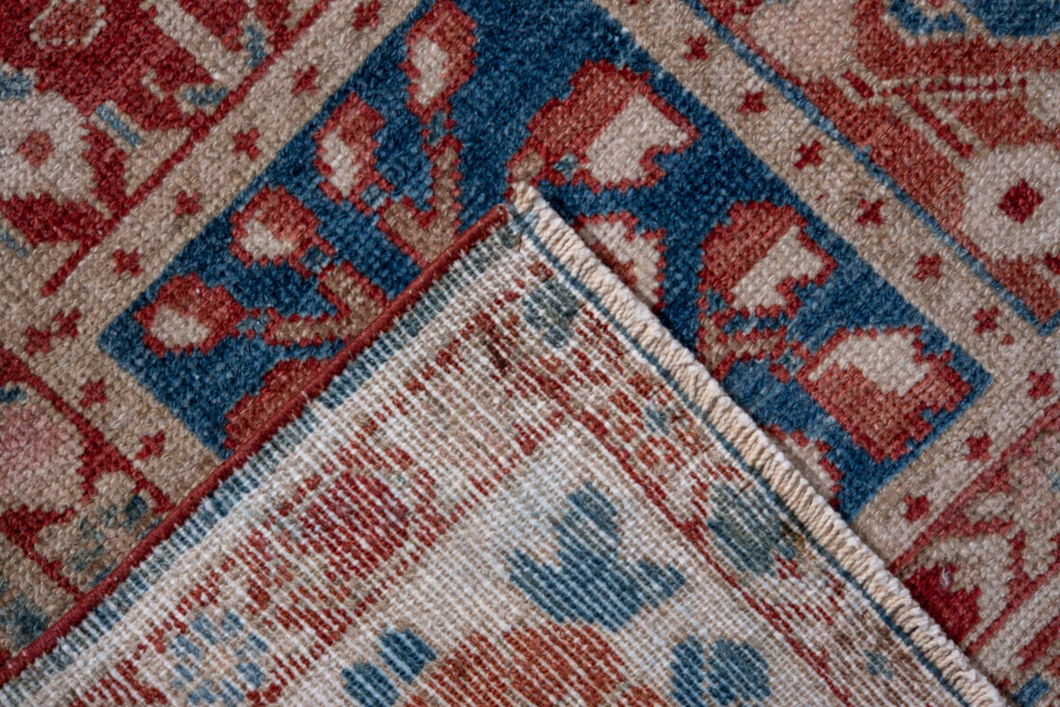 7' x 9' one-of-a-kind handmade vintage Baktiary rug. Color palette: ivory, coral, brick red, sky blue, dusty rose