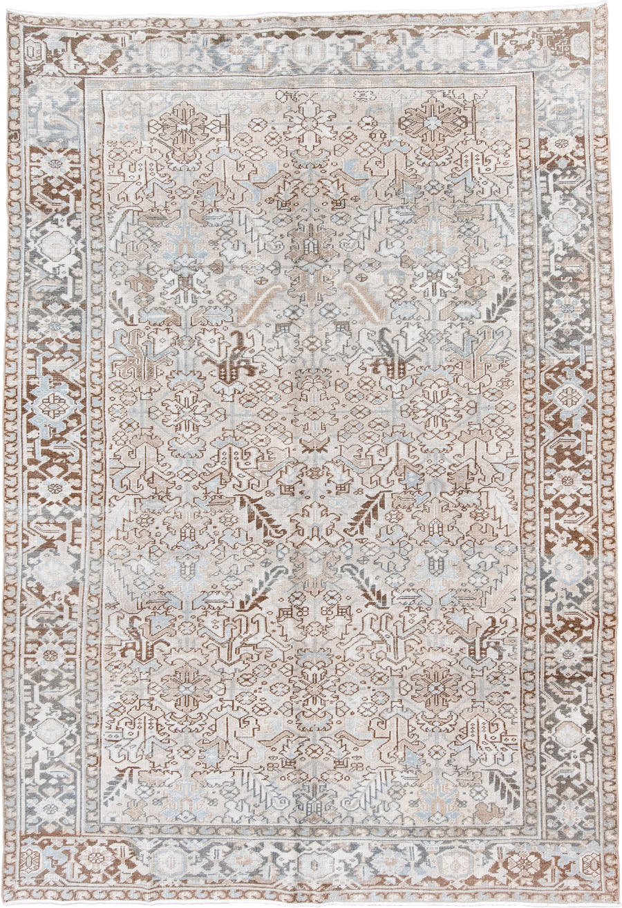 7' x 11' one-of-a-kind handmade antique Heriz large size rug. Color palette: ivory, taupe, light blue, camel, brown, cream