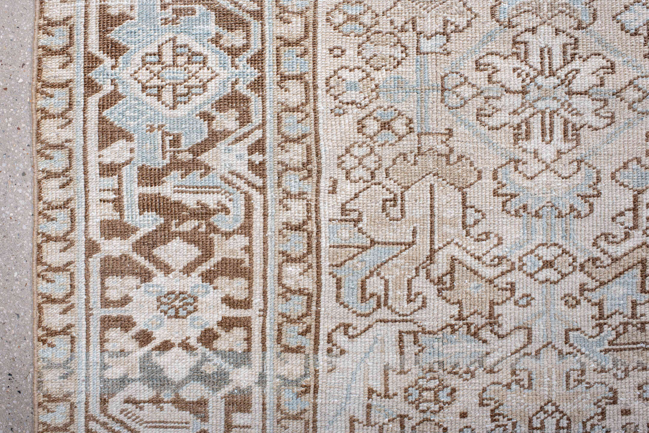 7' x 11' one-of-a-kind handmade antique Heriz large size rug. Color palette: ivory, taupe, light blue, camel, brown, cream