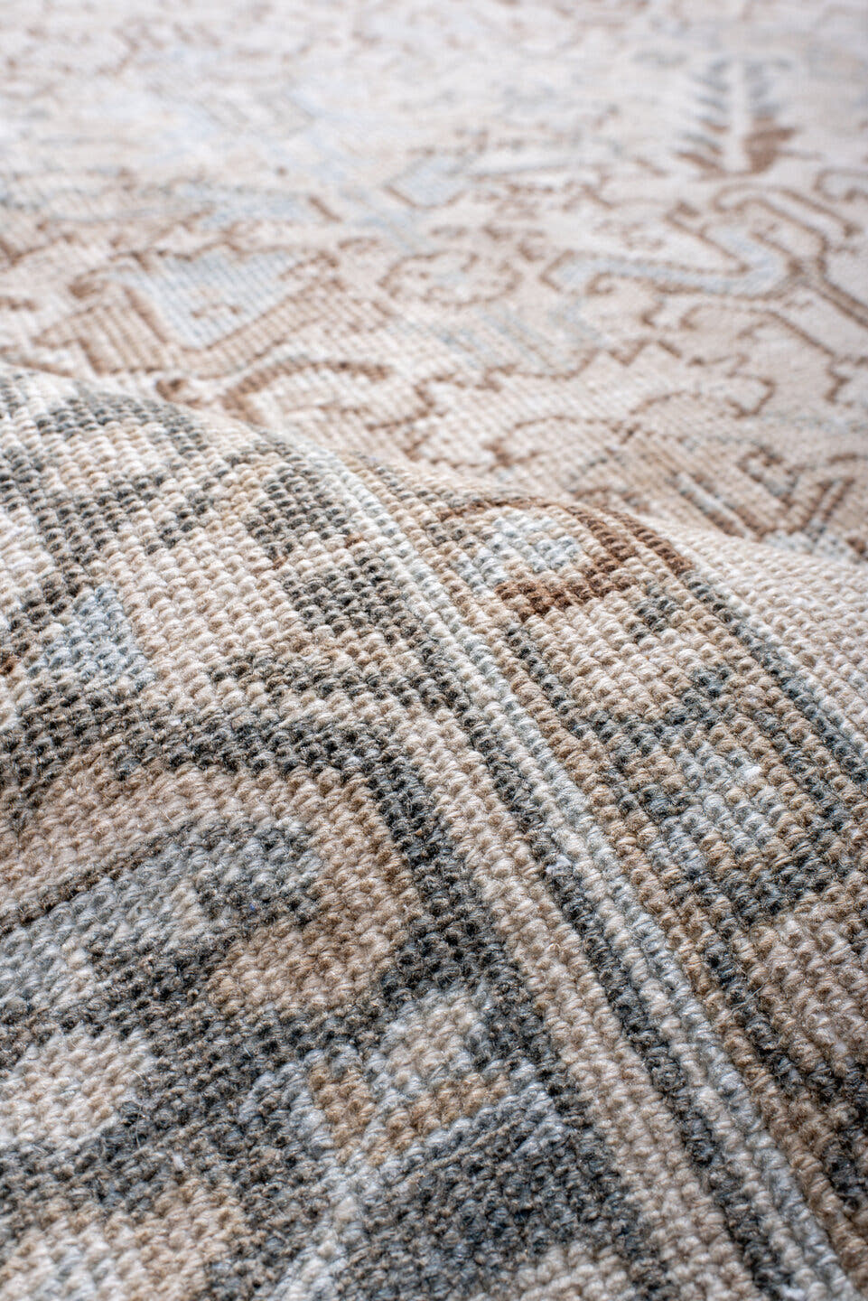 7' x 11' one-of-a-kind handmade antique Heriz large size rug. Color palette: ivory, taupe, light blue, camel, brown, cream