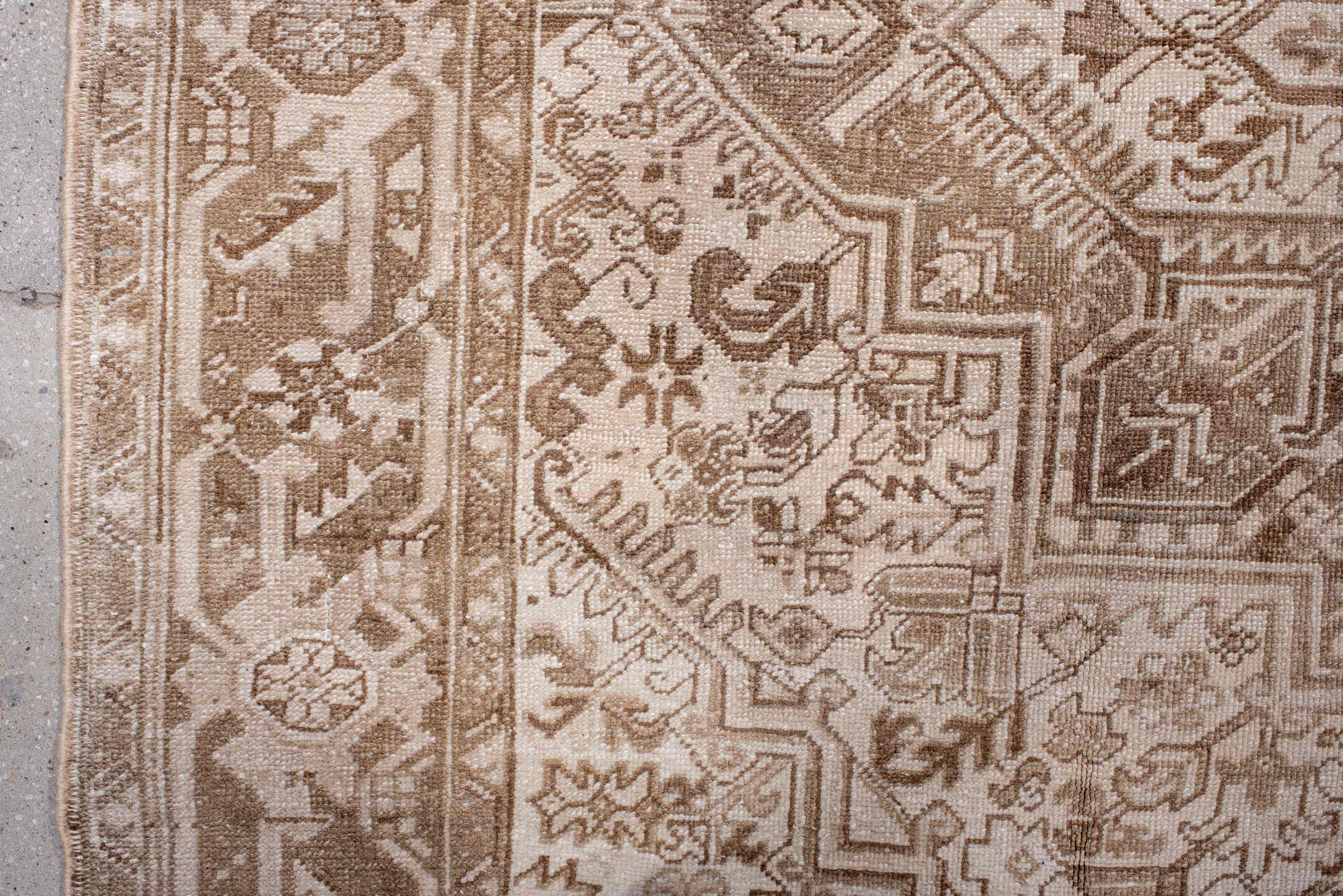 7' x 9' one-of-a-kind handmade antique Heriz rug. Color palette: ivory, camel, taupe, beige, sand, gray
