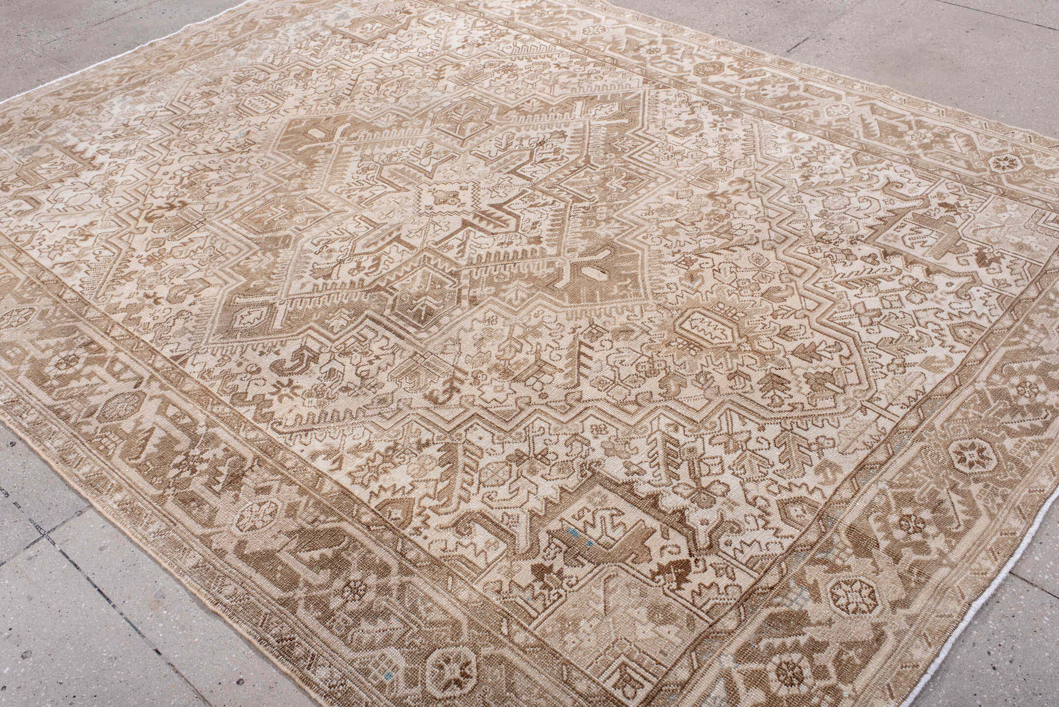 7' x 9' one-of-a-kind handmade antique Heriz rug. Color palette: ivory, camel, taupe, beige, sand, gray