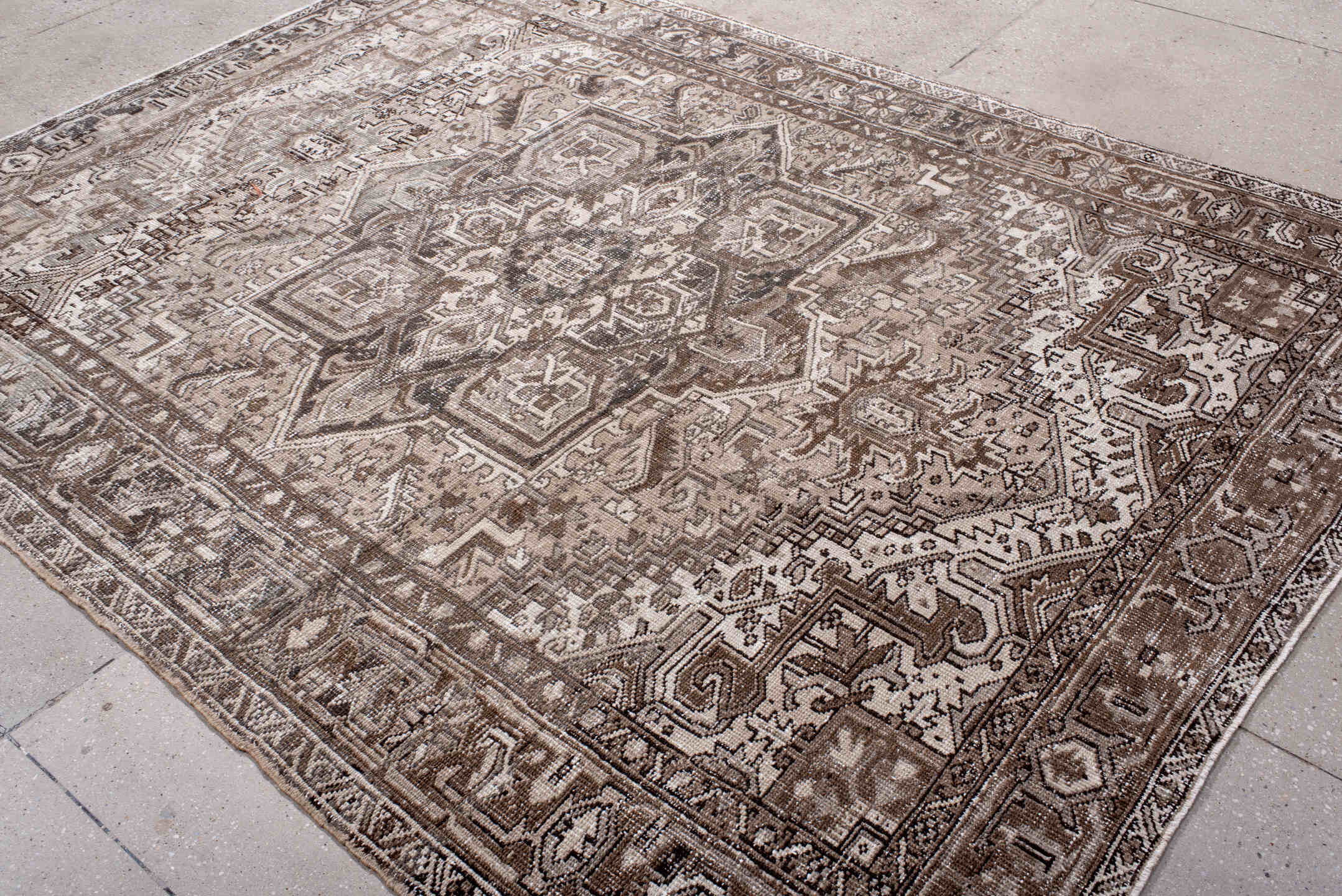 6' x 8' one-of-a-kind handmade antique Heriz medium size rug. Color palette: taupe, ivory, brown, rose, charcoal, beige