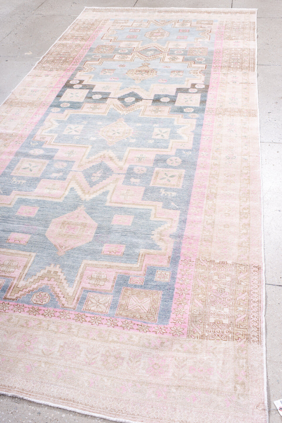 5' x 12' one-of-a-kind handmade antique Ardebil rug. Color palette: ivory, pale blue, blush, taupe, camel, charcoal