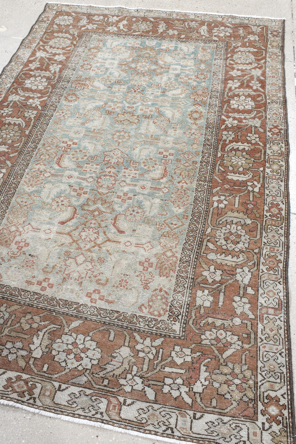4' x 7' one-of-a-kind handmade vintage Malayer rug. Color palette: ivory, rust, pale blue, taupe, camel, rose, brown
